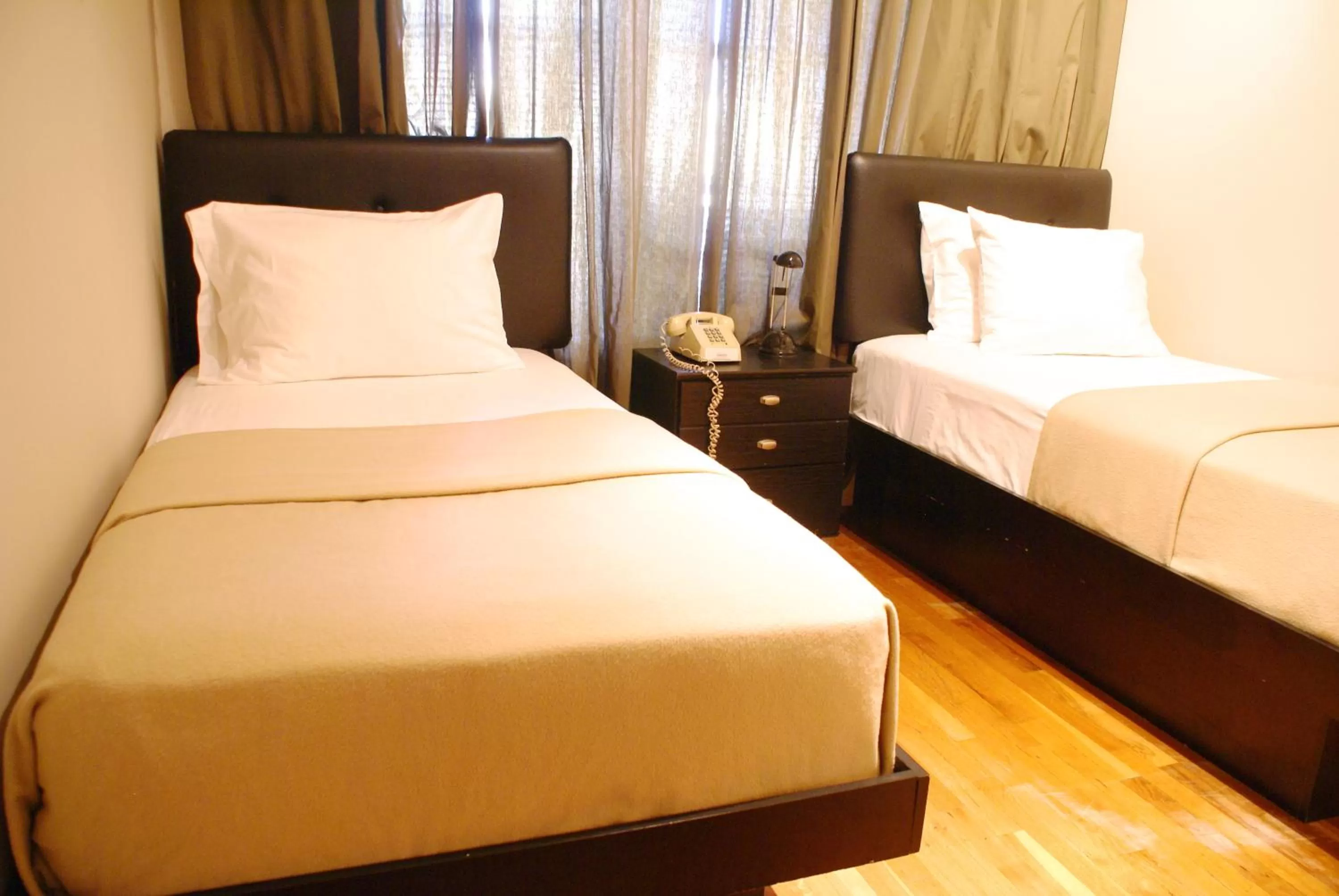 Bed in Off SoHo Suites Hotel