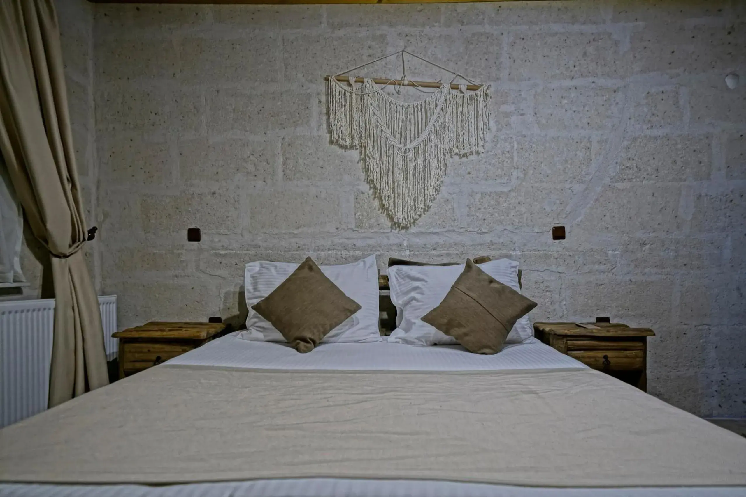 Bed in Holiday Cave Hotel