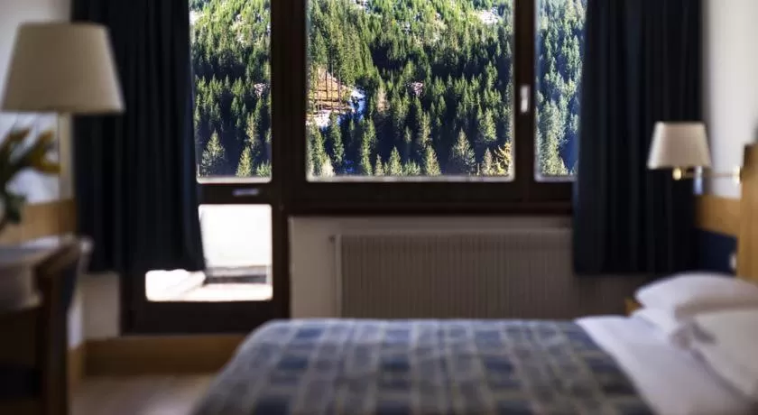 Photo of the whole room, Bed in Hotel Club Regina E Fassa