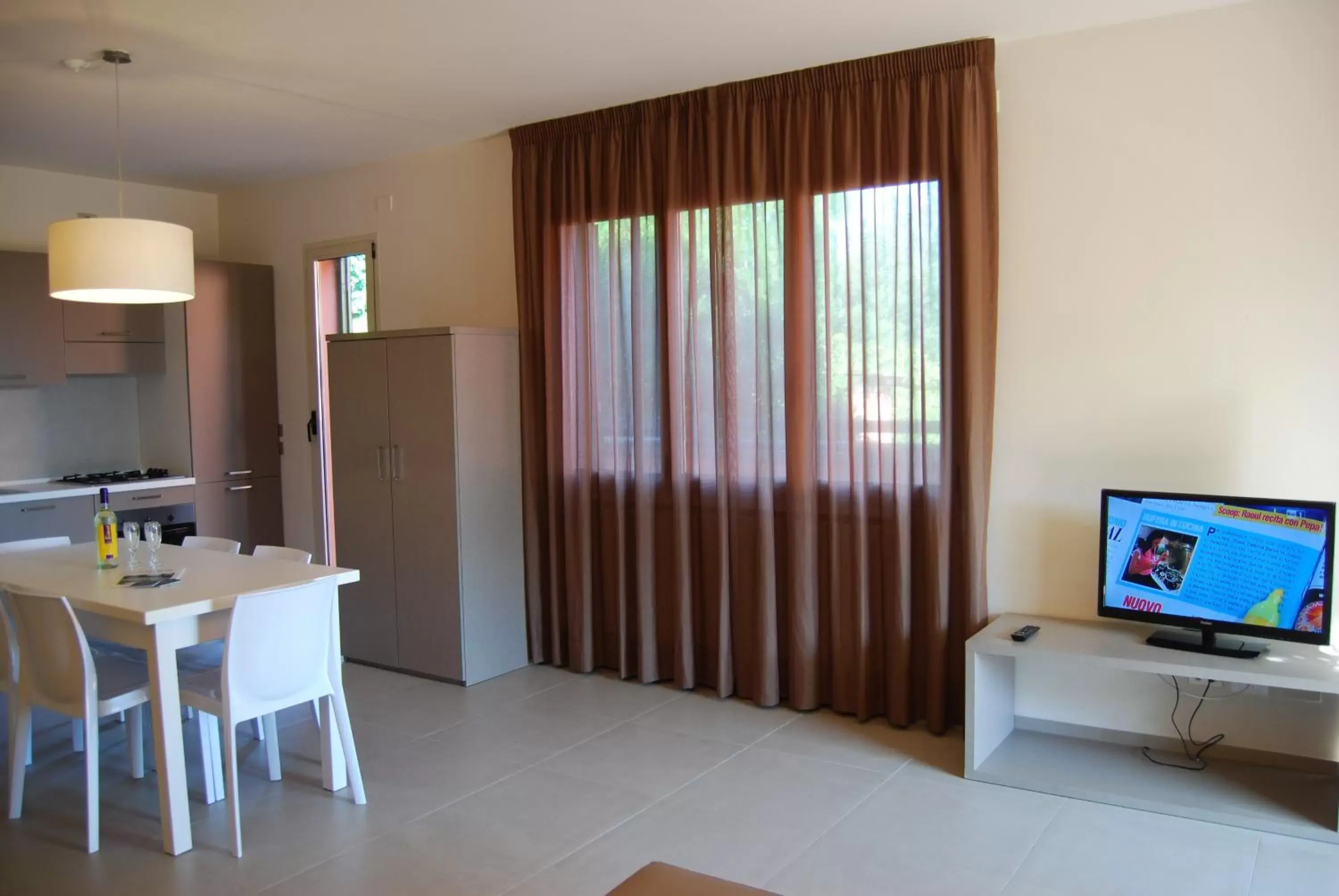 Dining area, TV/Entertainment Center in Residenze Al Colle Dei Pini