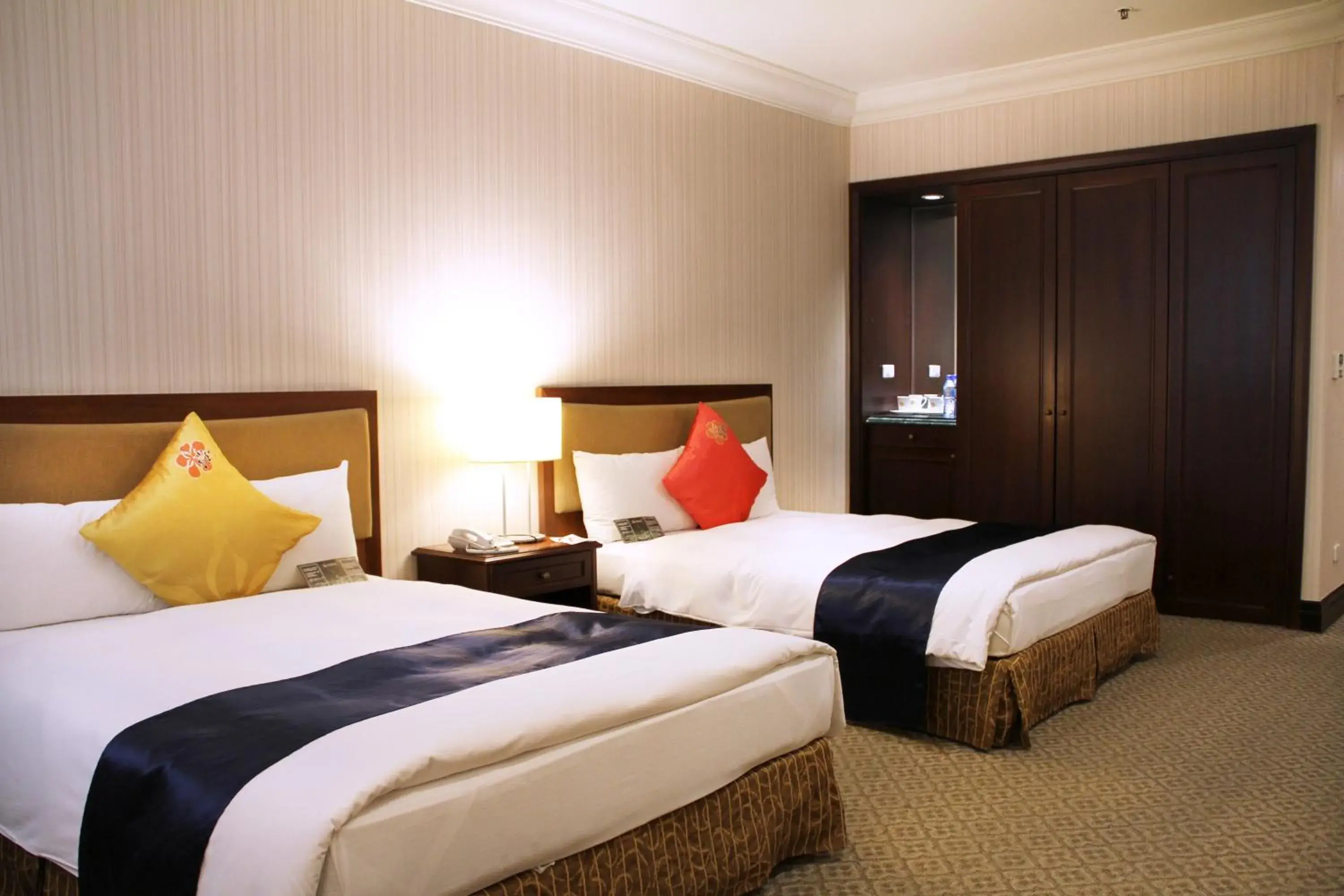 Bed in Wei-Yat Grand Hotel