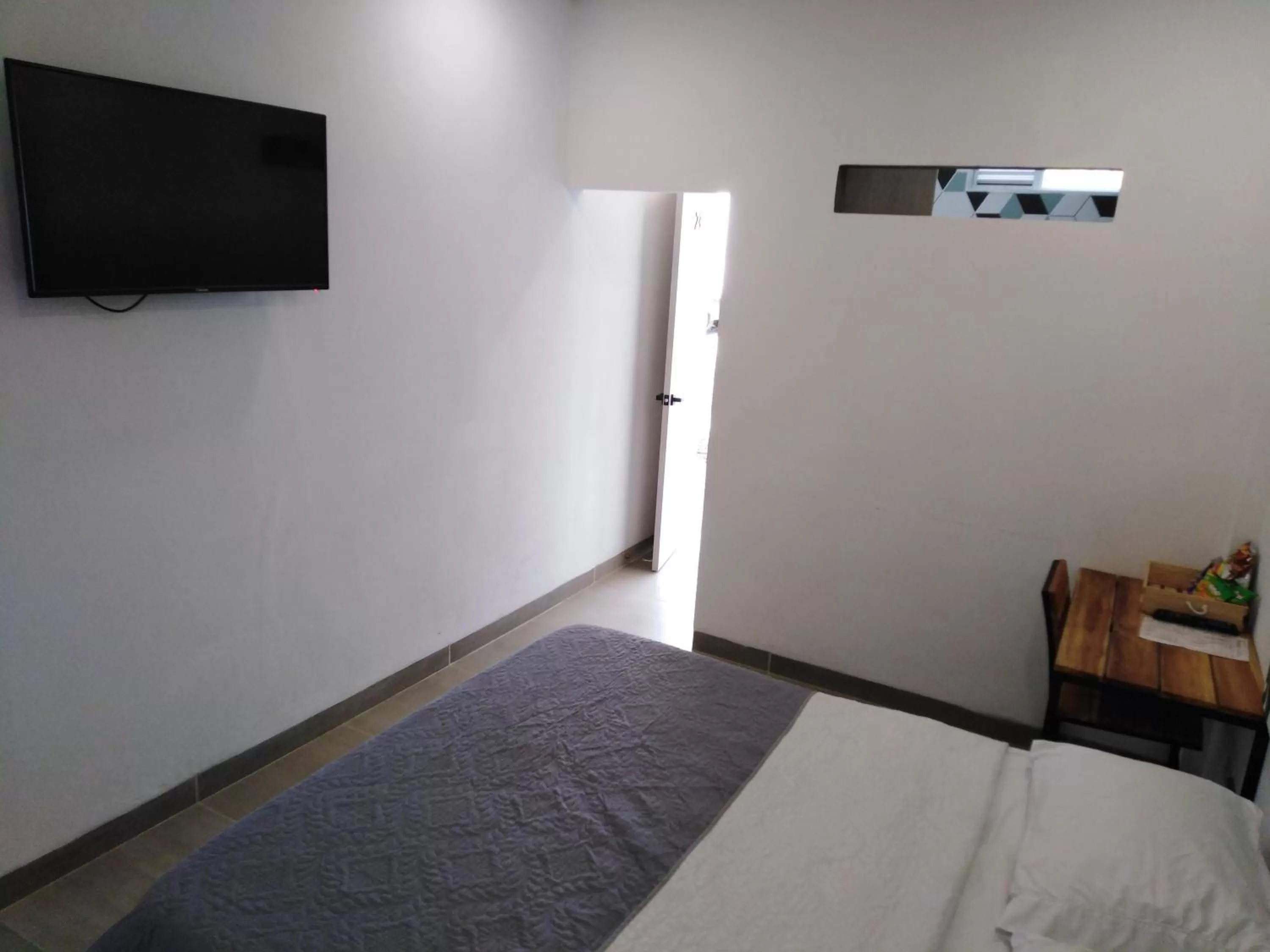 Bed, TV/Entertainment Center in Hotel La Aldea del Oriente