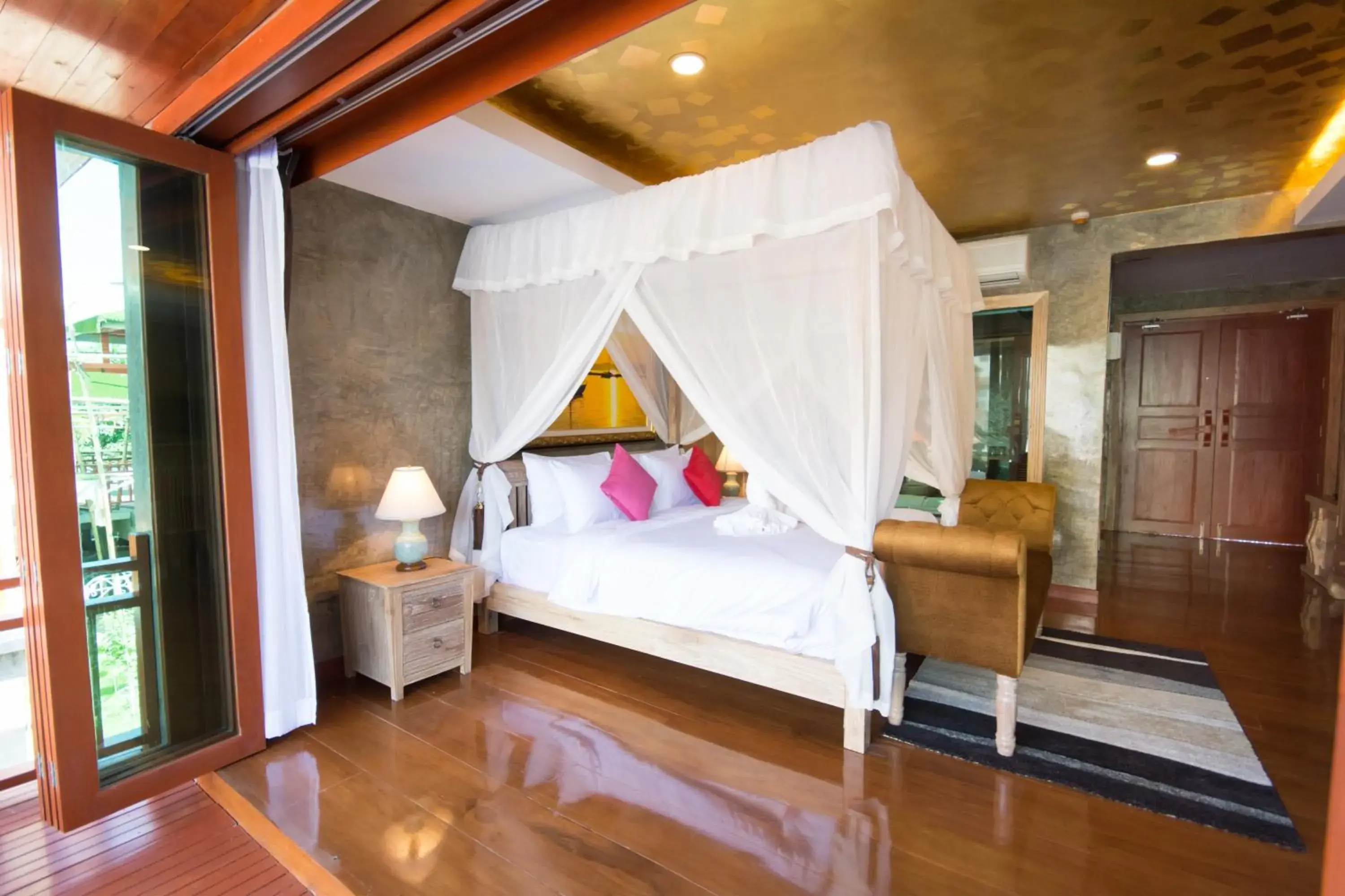 Bed in The Chaya Resort and Spa