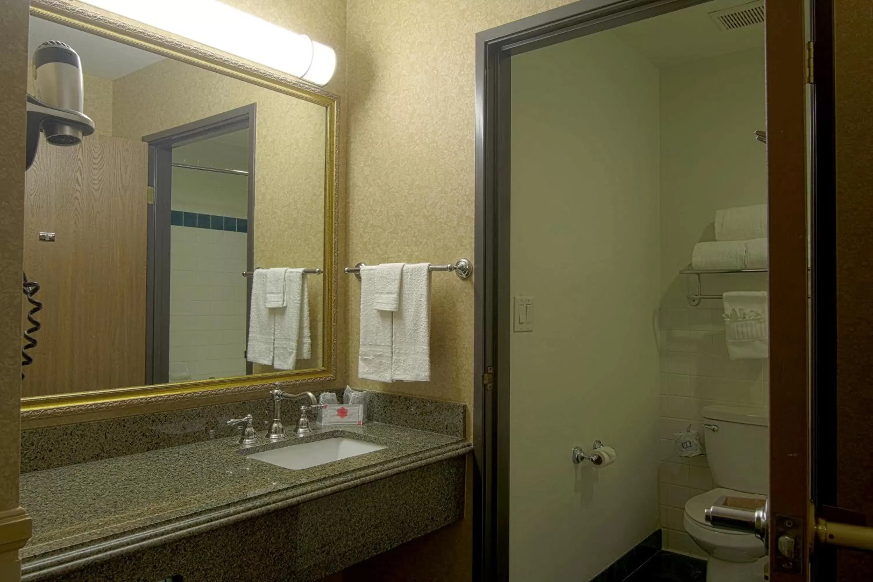 Bathroom in Azure Hotel&Suites Ontario Trademark Collection by Wyndham