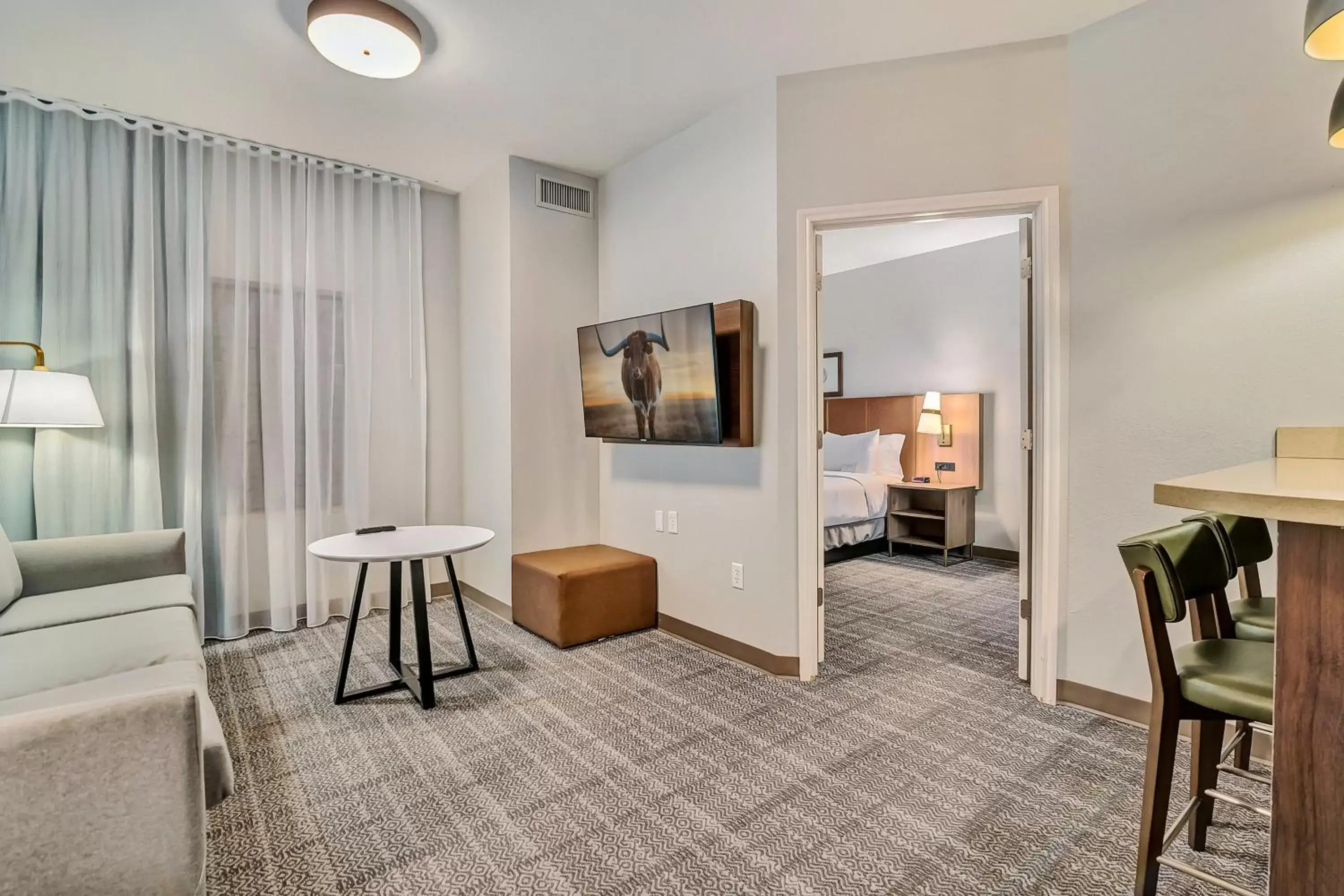 Photo of the whole room, Seating Area in Staybridge Suites Tyler University Area, an IHG Hotel