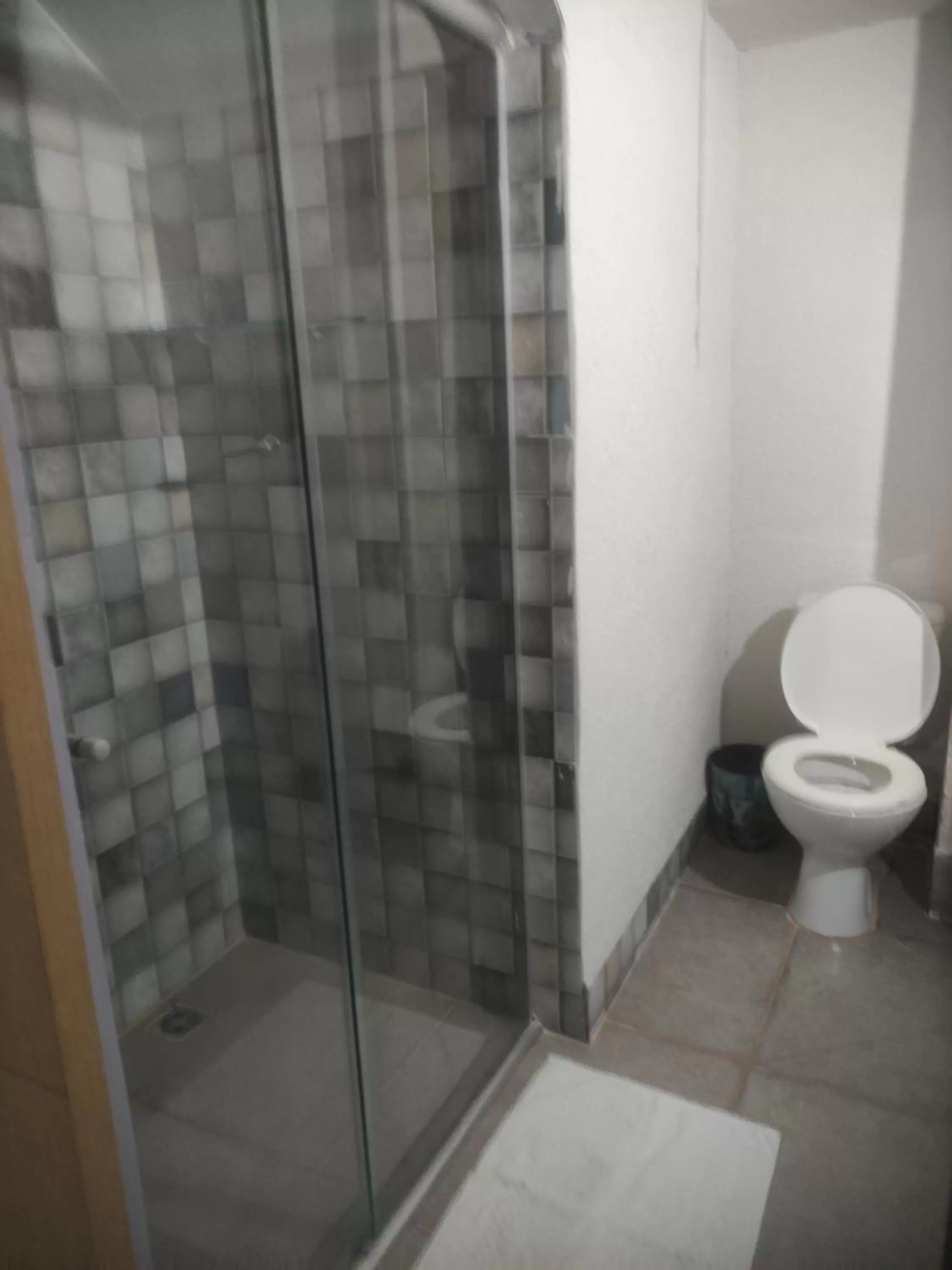 Bathroom in Pousada da Gi Suítes e Turismo