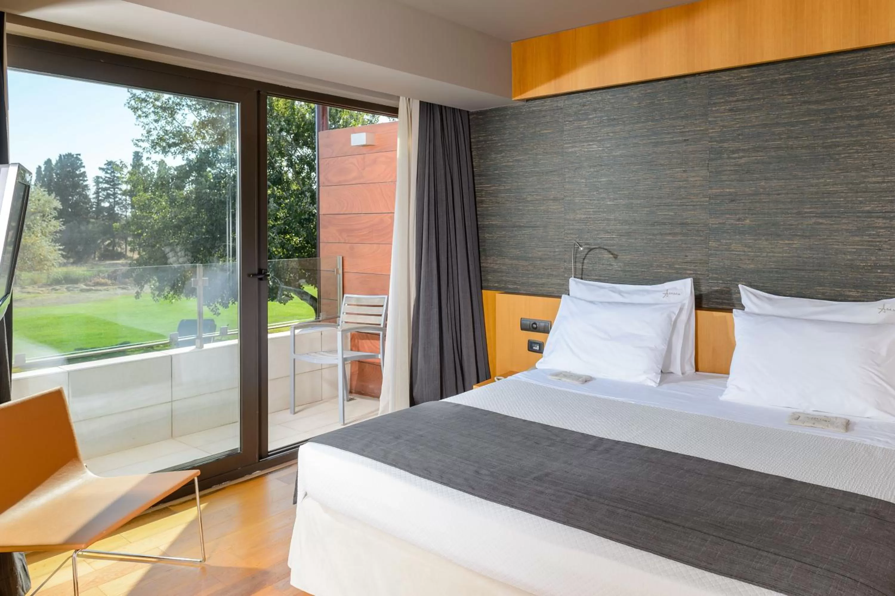 Bed in Alexander Beach Hotel & Spa