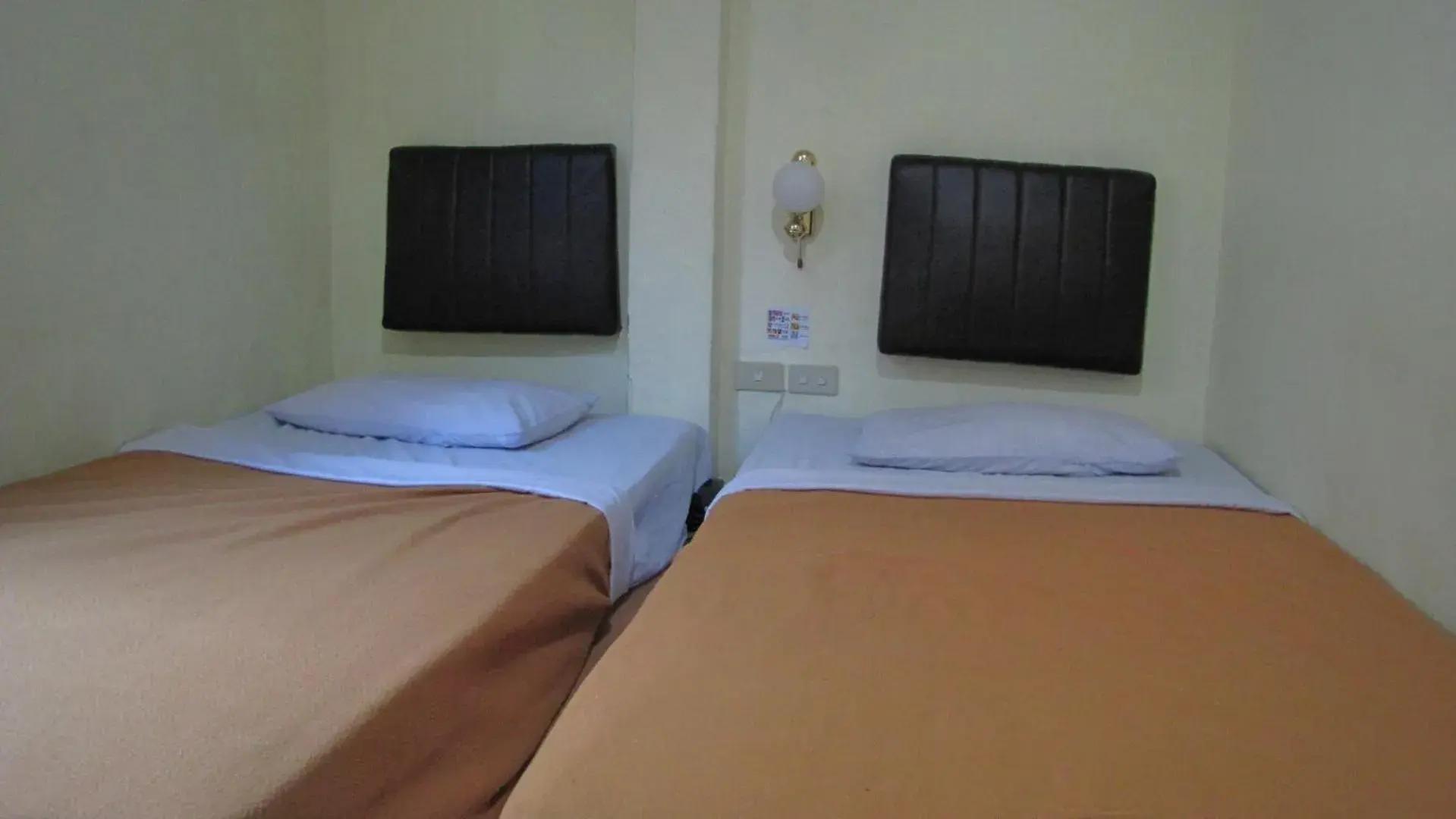 Bed in Hotel Mitra Garden