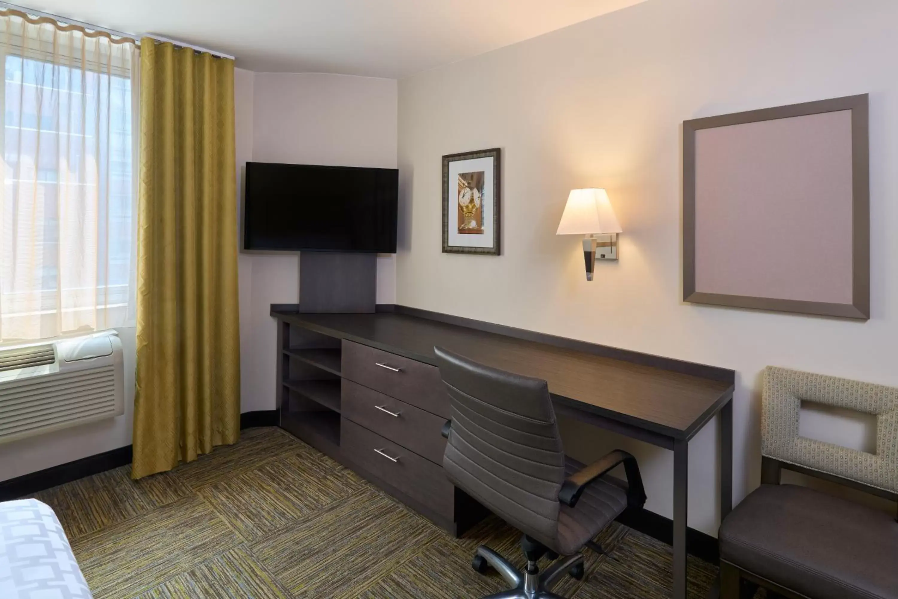 Seating area, TV/Entertainment Center in Candlewood Suites NYC -Times Square, an IHG Hotel