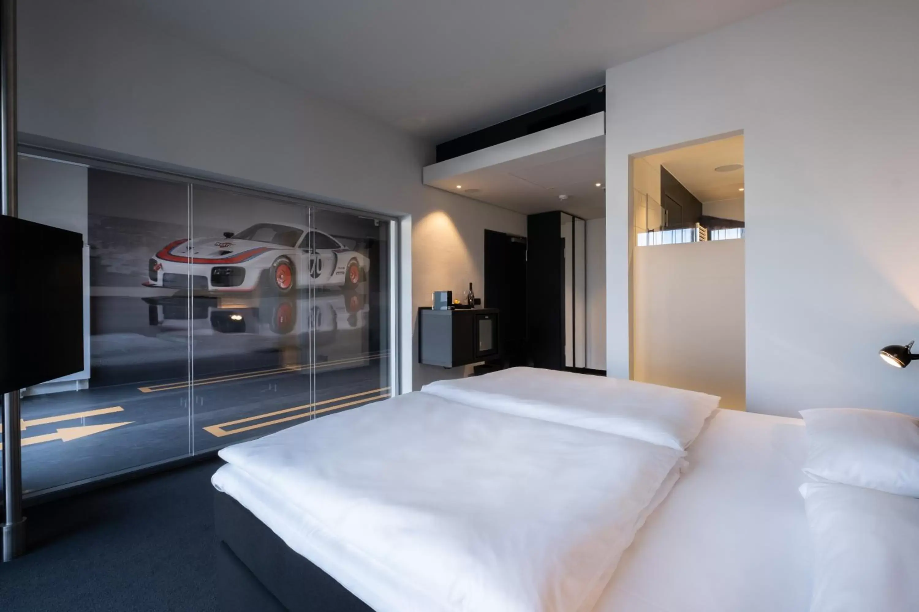 Photo of the whole room, Bed in V8 Hotel Köln at MOTORWORLD