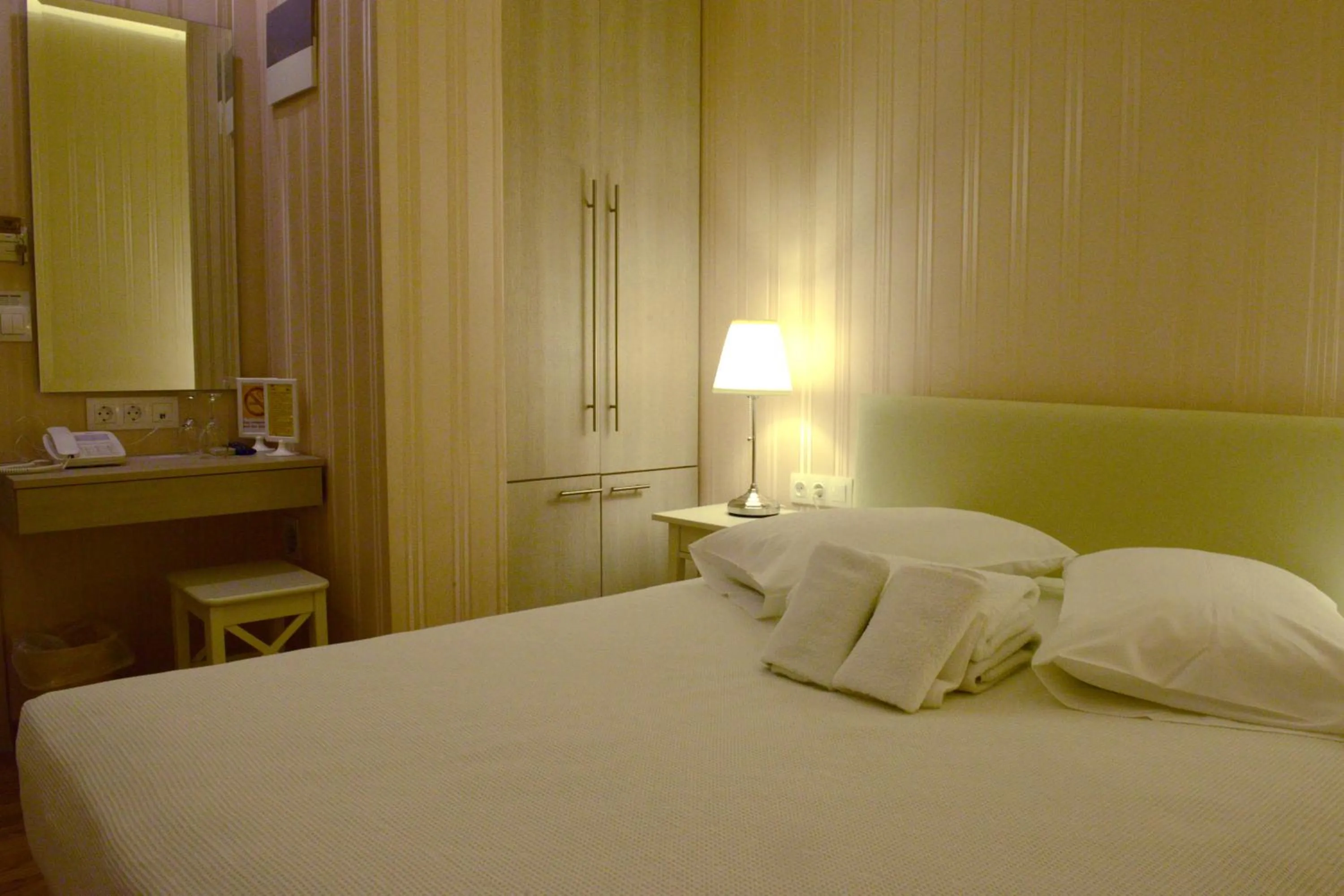 Bed in Phidias Hotel