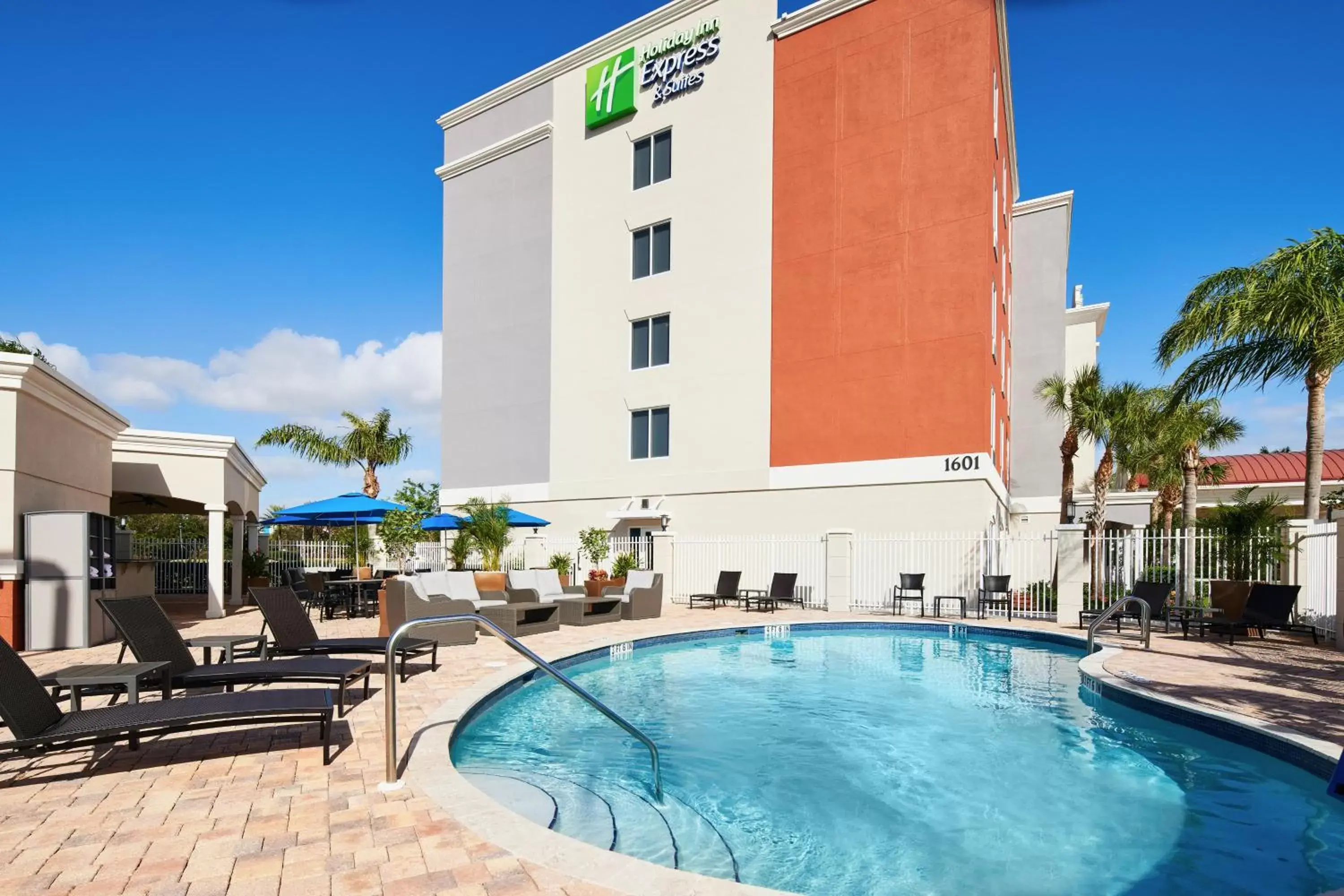 Swimming pool, Property Building in Holiday Inn Express Hotel & Suites Port St. Lucie West, an IHG Hotel