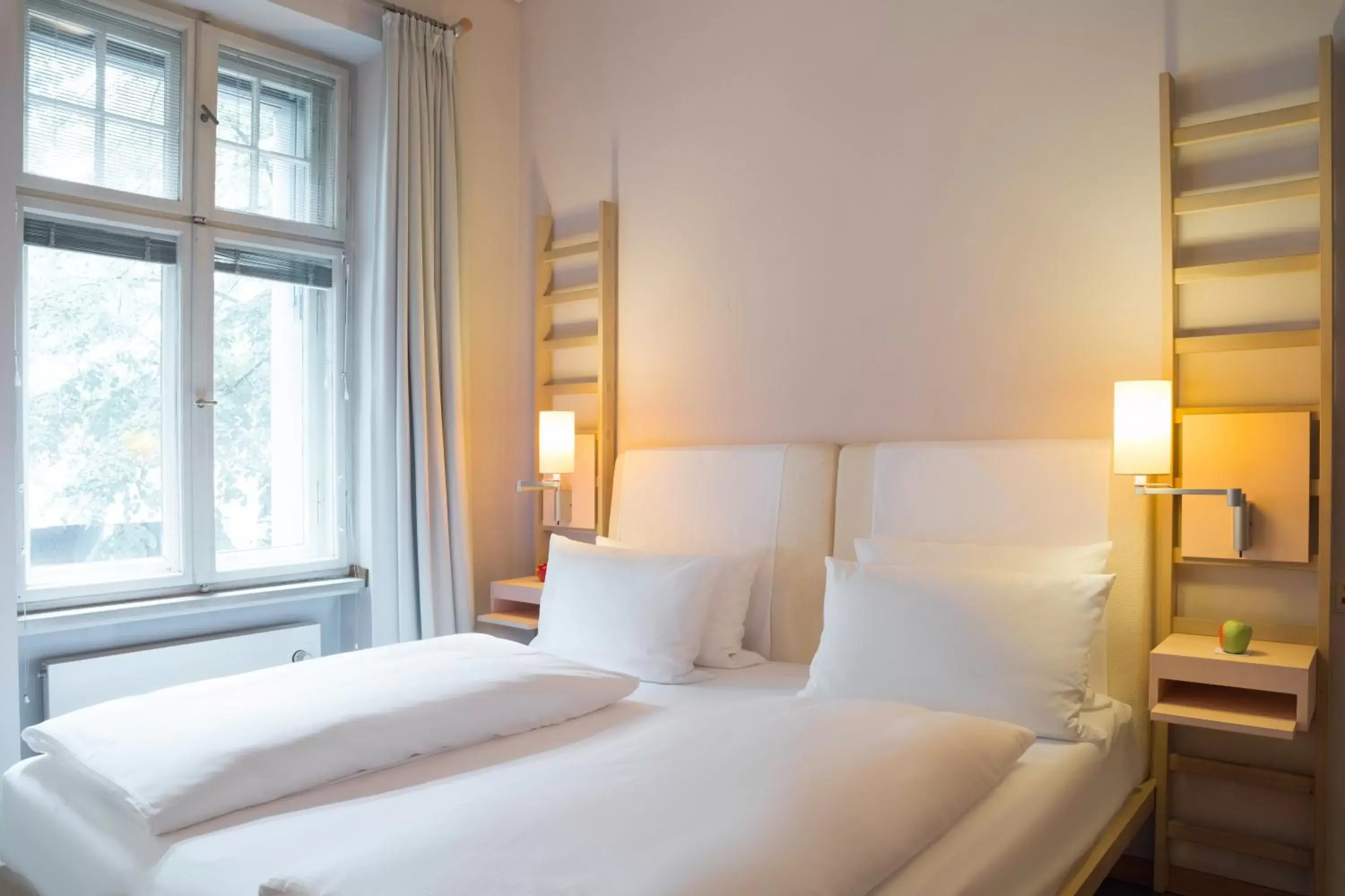 Bed in Hotel Bleibtreu Berlin by Golden Tulip