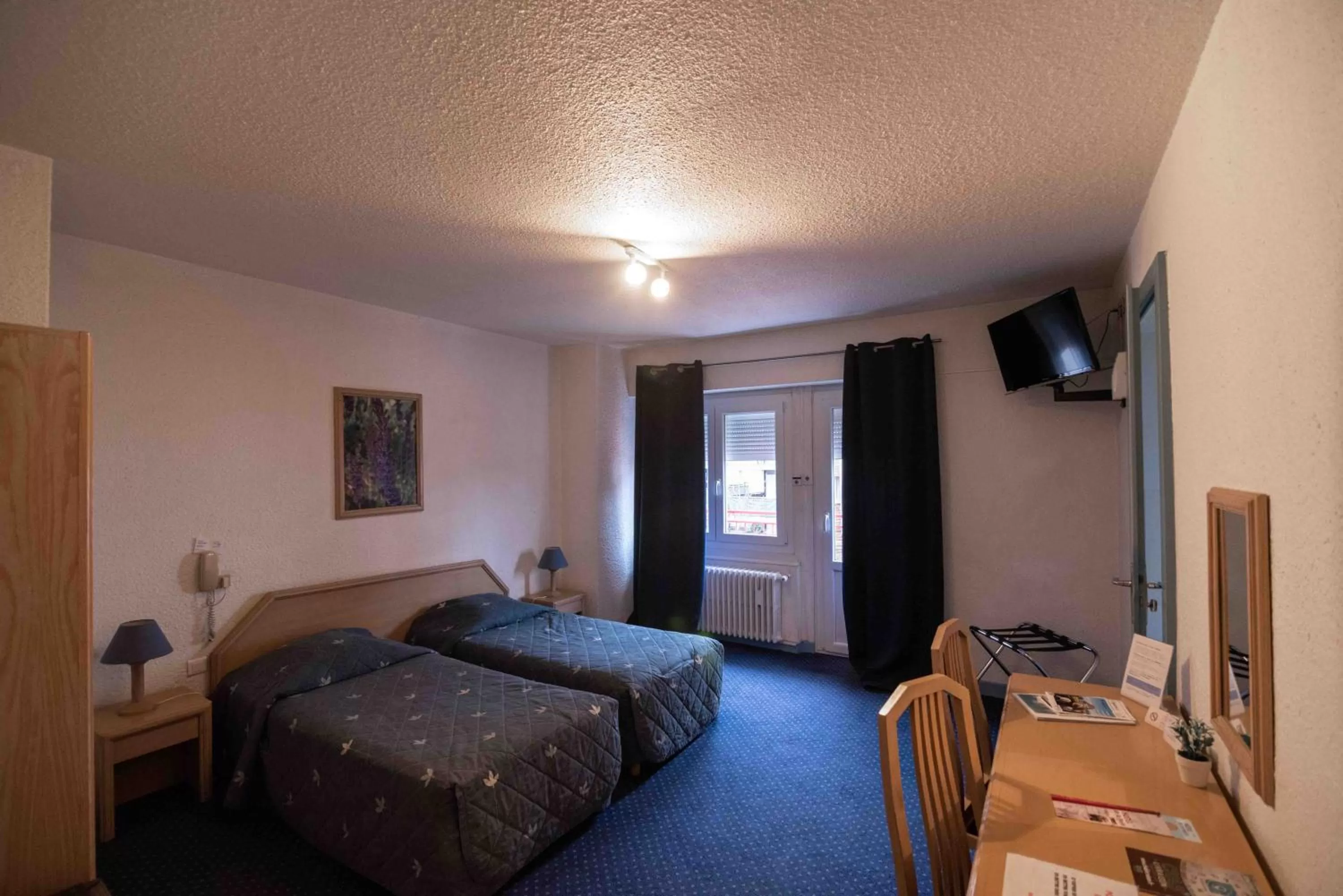 Photo of the whole room, Bed in Hôtel de La Poste