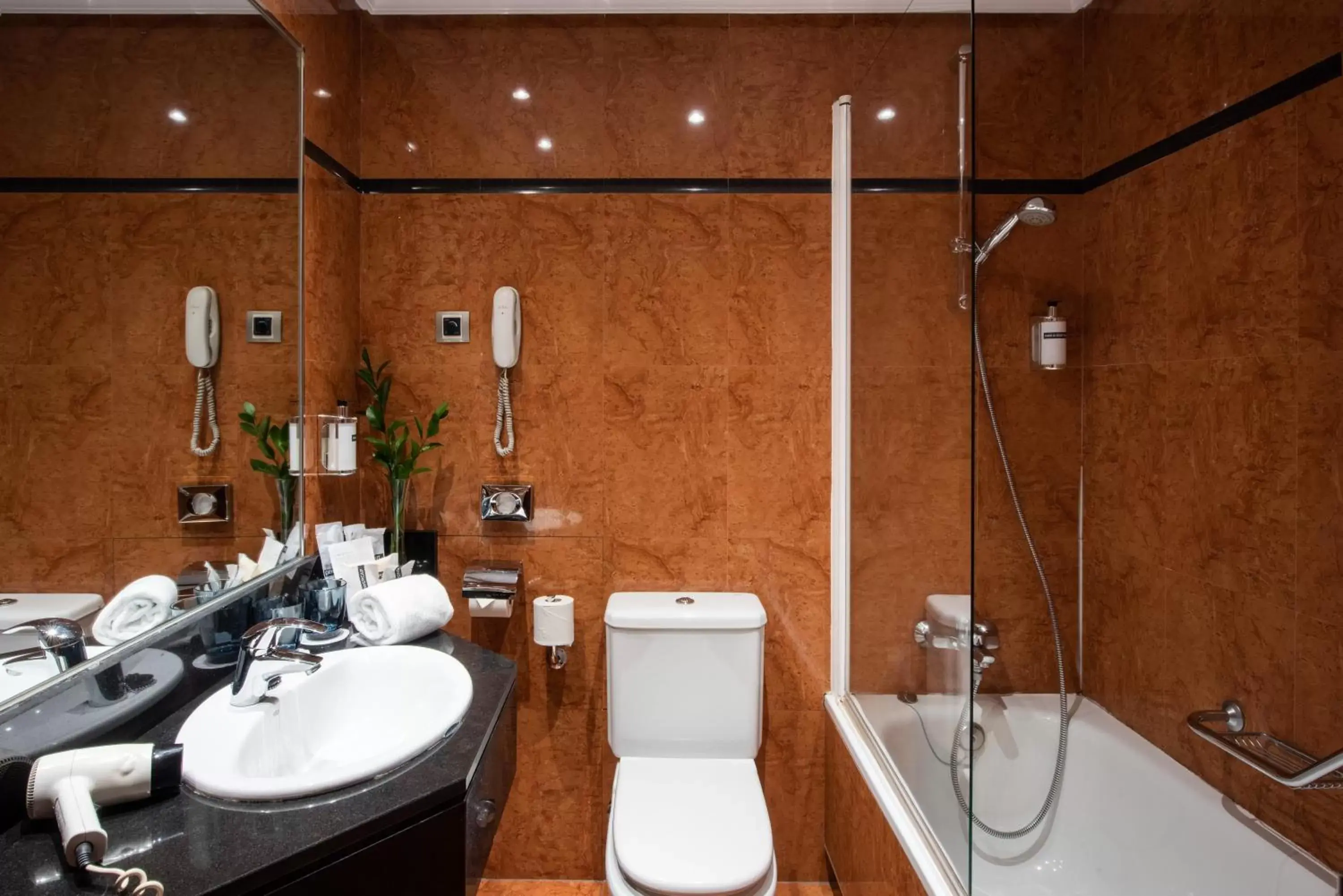 Toilet, Bathroom in Hotel Madrid Plaza de España, Affiliated by Meliá