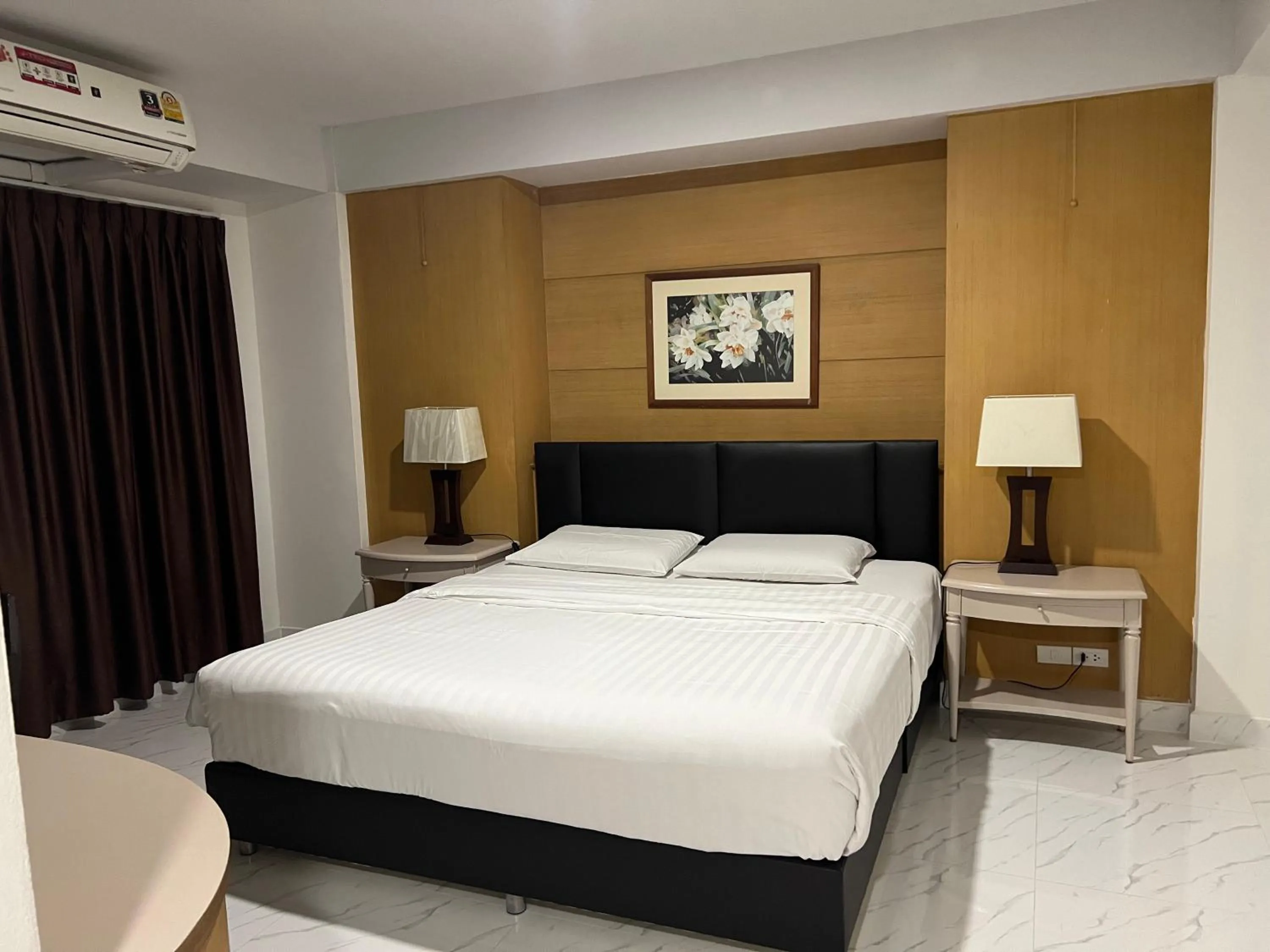 Bed in Mall Suites Hotel