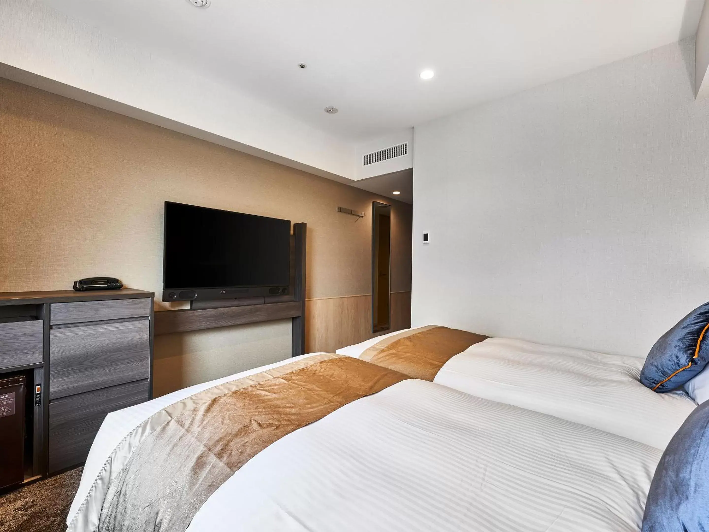 Bed in DEL style Osaka-Shinsaibashi by Daiwa Roynet Hotel