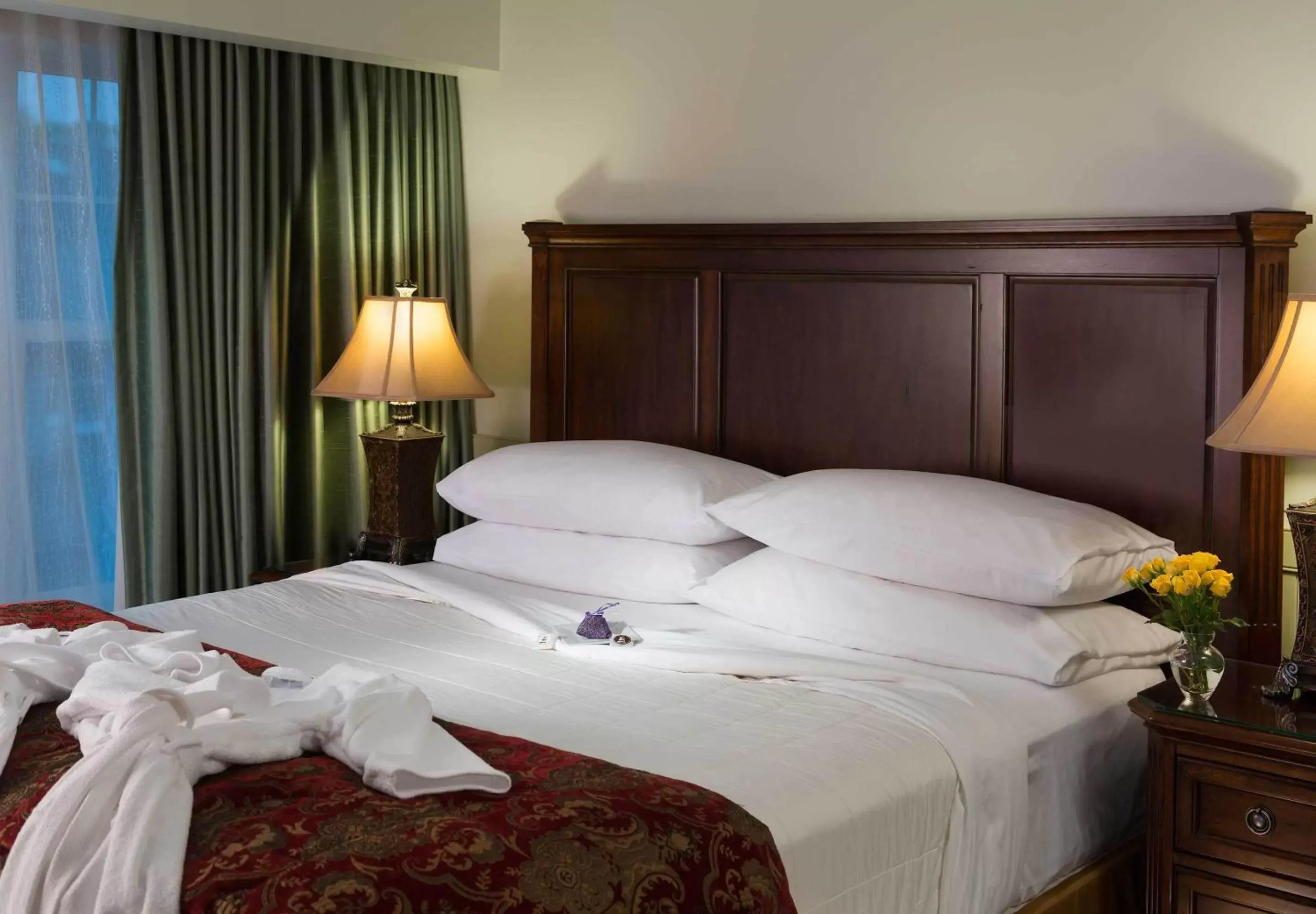 Bed in Grand Harbor Inn