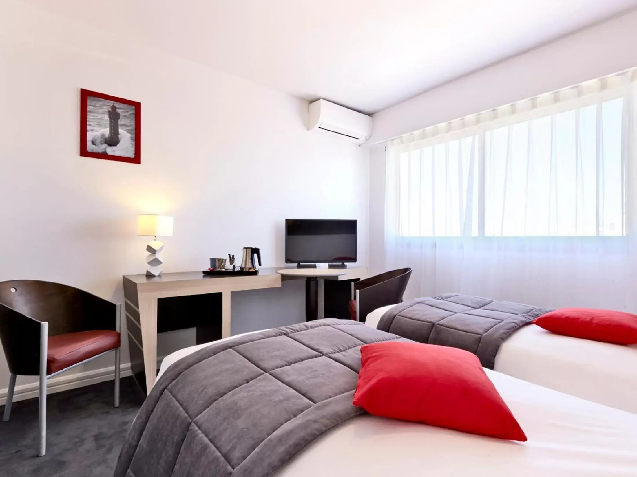 Bedroom, Seating Area in Kyriad Prestige Les Sables d'Olonne - Plage - Centre des Congrès