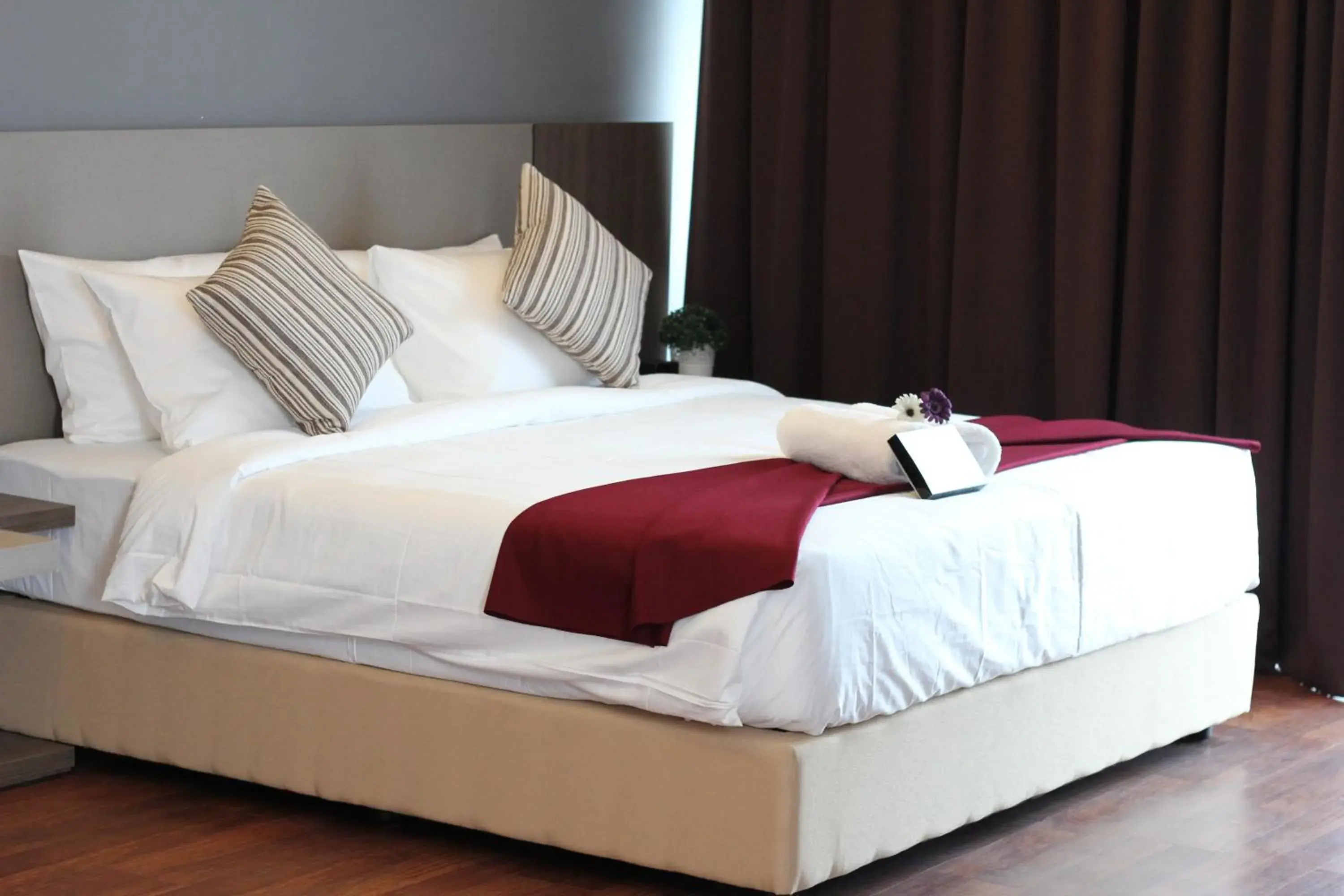 Bed in Nexus Business Suite Hotel