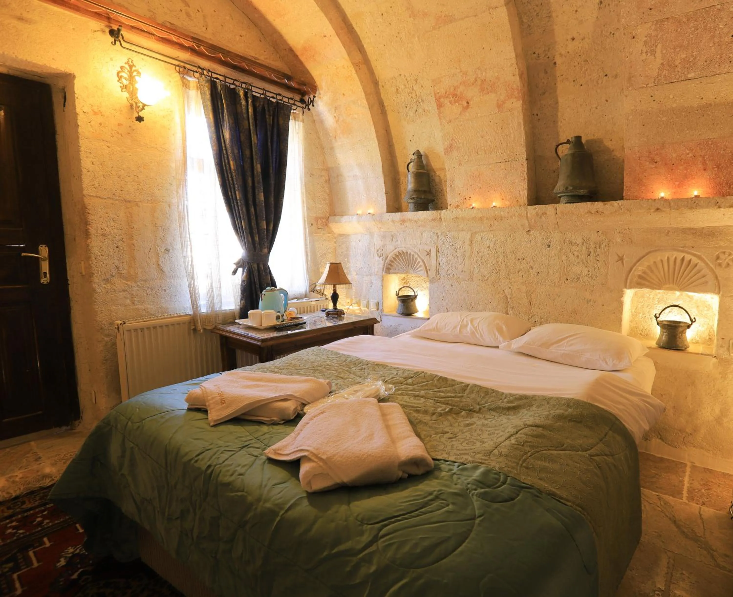 Property building, Bed in Antique Terrace Cave Suites