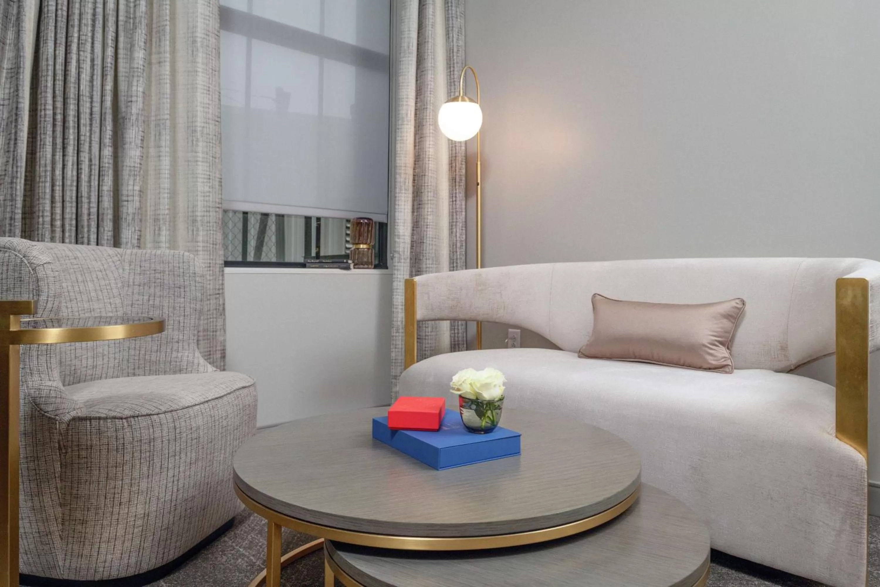 Living room, Bed in Tulsa Club Hotel Curio Collection By Hilton