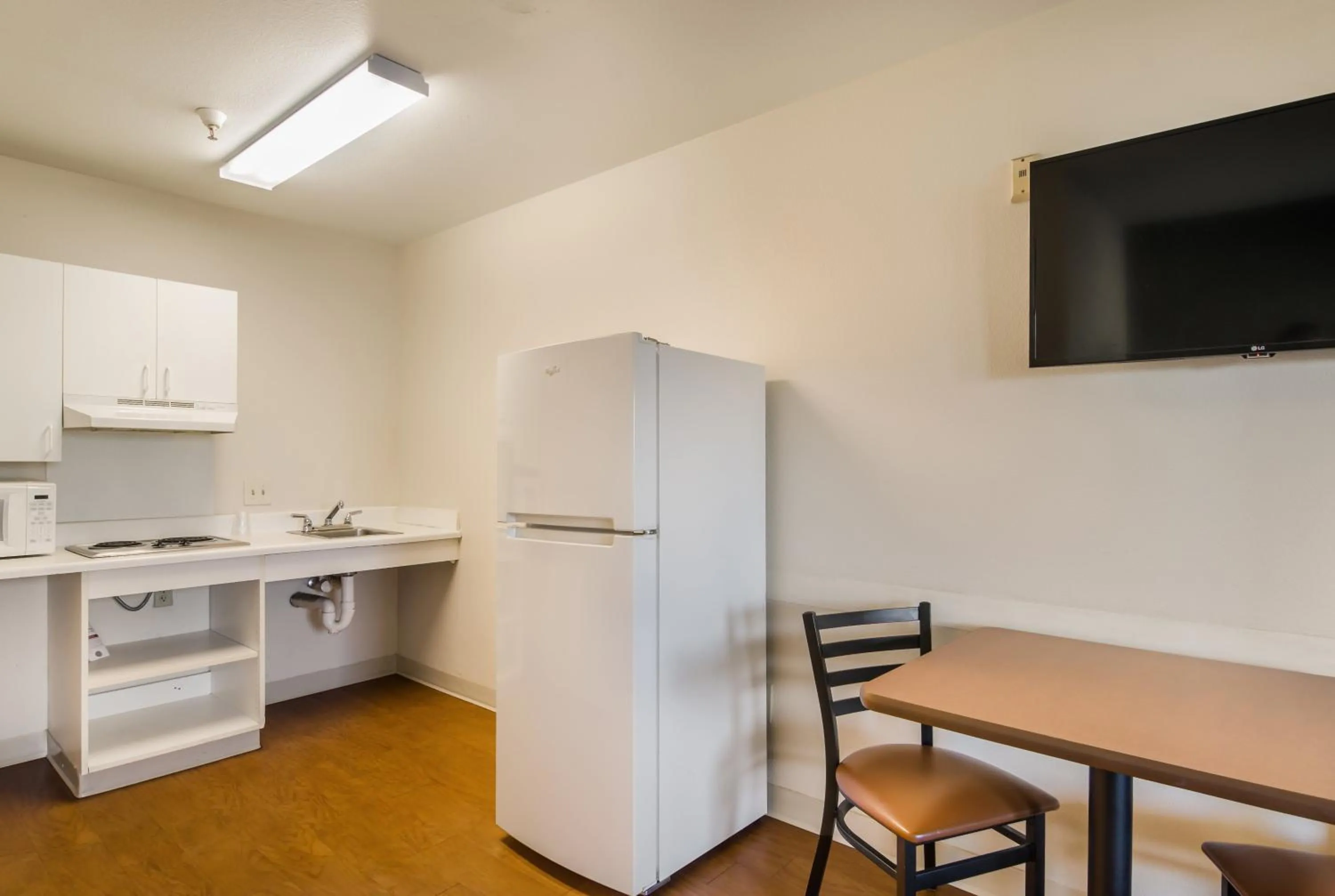 Photo of the whole room in HomeTowne Studios by Red Roof Denver - Airport/Aurora