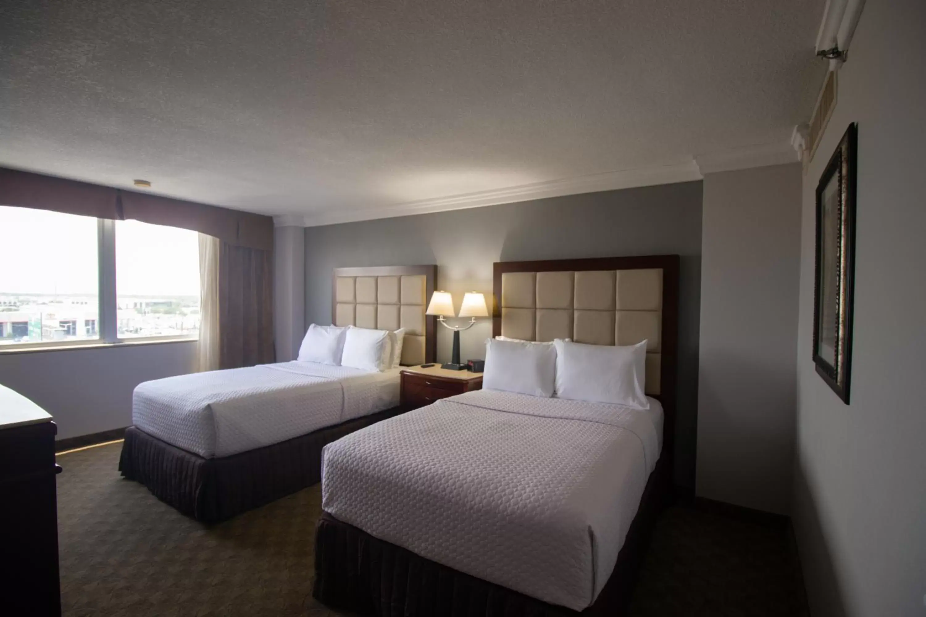 Deluxe Room with Two Double Beds and Roll-In Shower - Mobility Accessible/Non-Smoking in Wyndham Houston near NRG Park - Medical Center Deluxe Room with Two Double Beds and Roll-In Shower - Mobility Accessible/Non-Smoking in Wyndham Houston near NRG Park - Medical Center