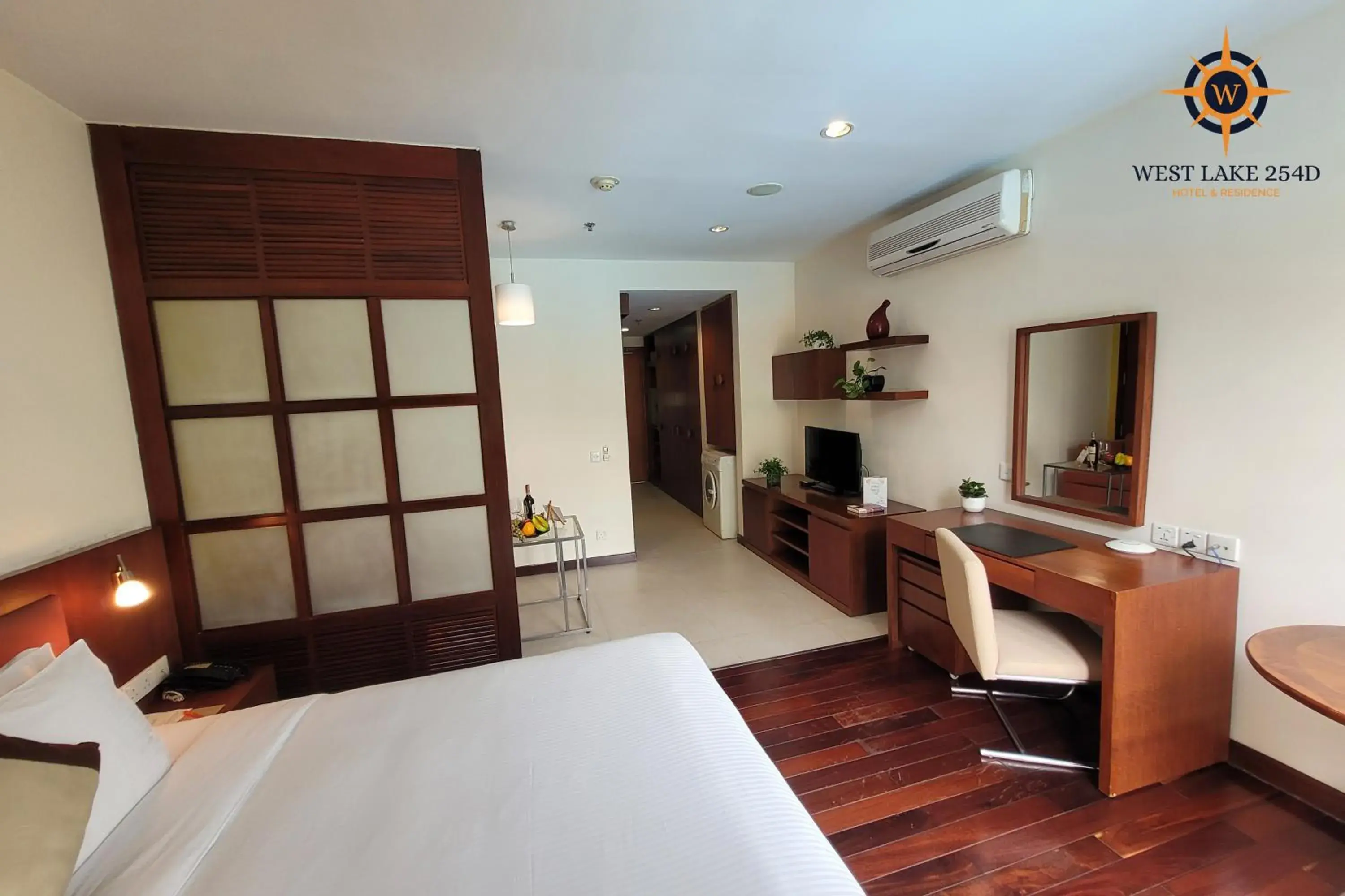 Bed, TV/Entertainment Center in West Lake 254D Hotel & Residence