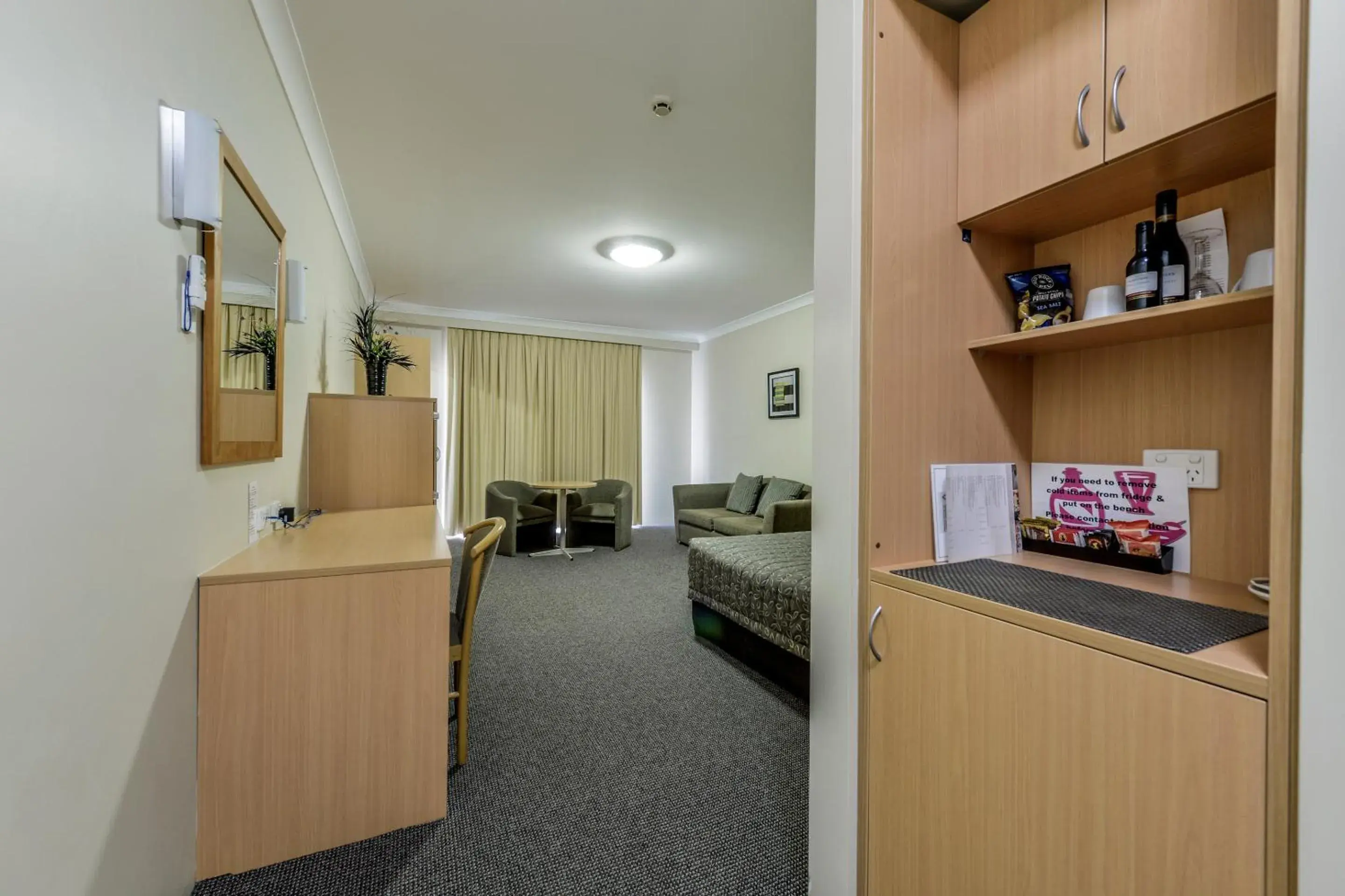 Photo of the whole room, Seating Area in Golden Guitar Motor Inn