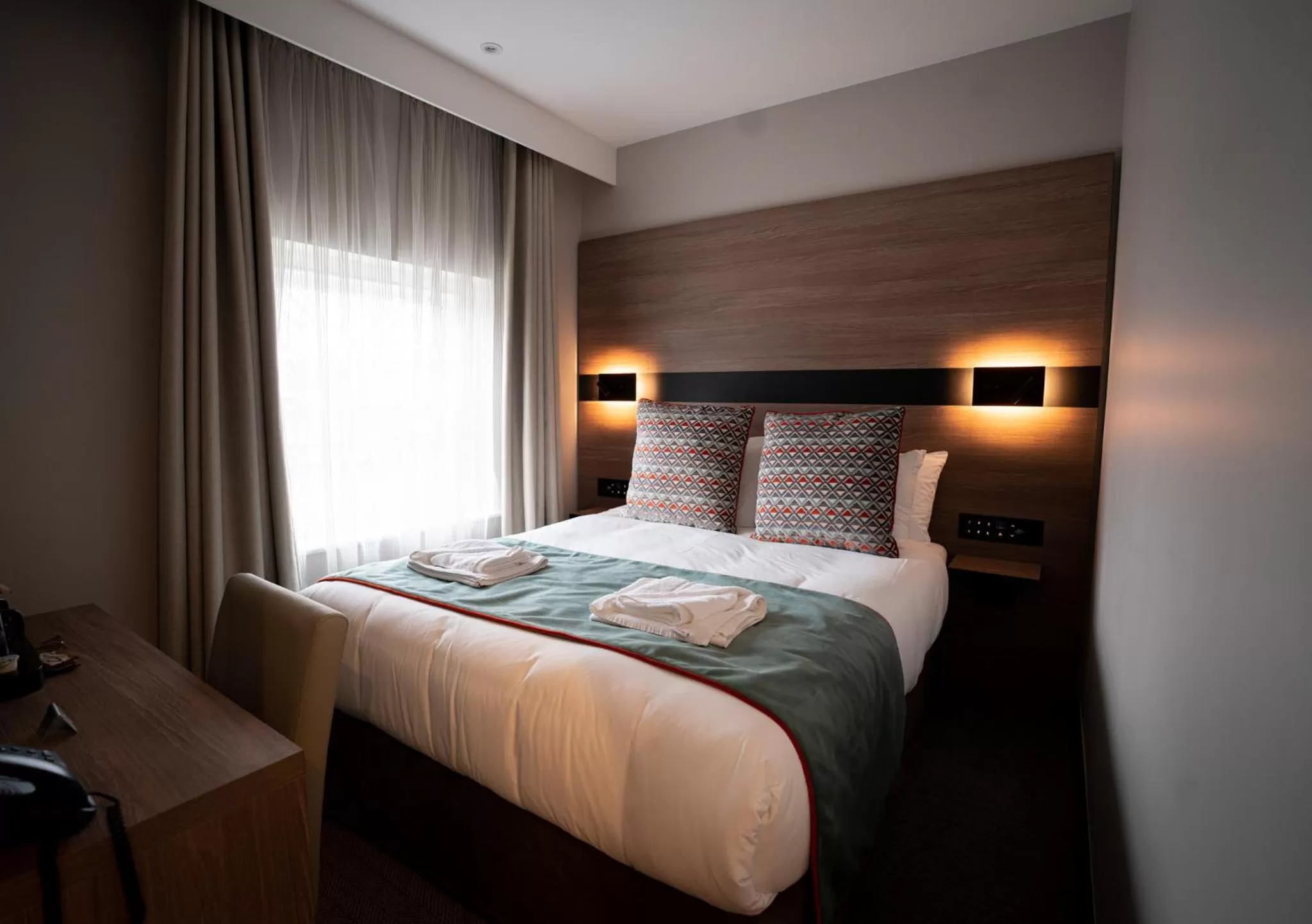 Bed in Merit Kensington Hotel