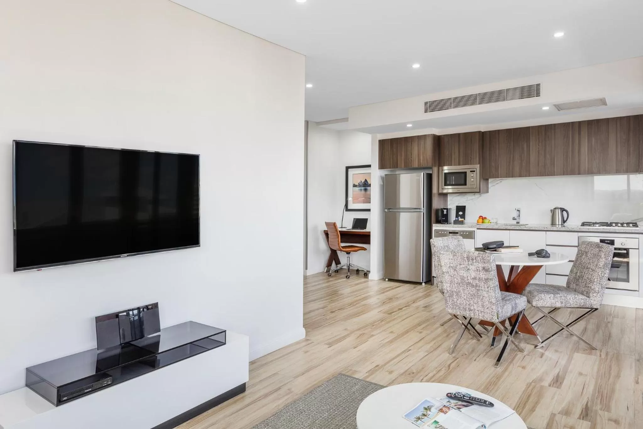 Communal lounge/ TV room in Meriton Suites Church Street, Parramatta