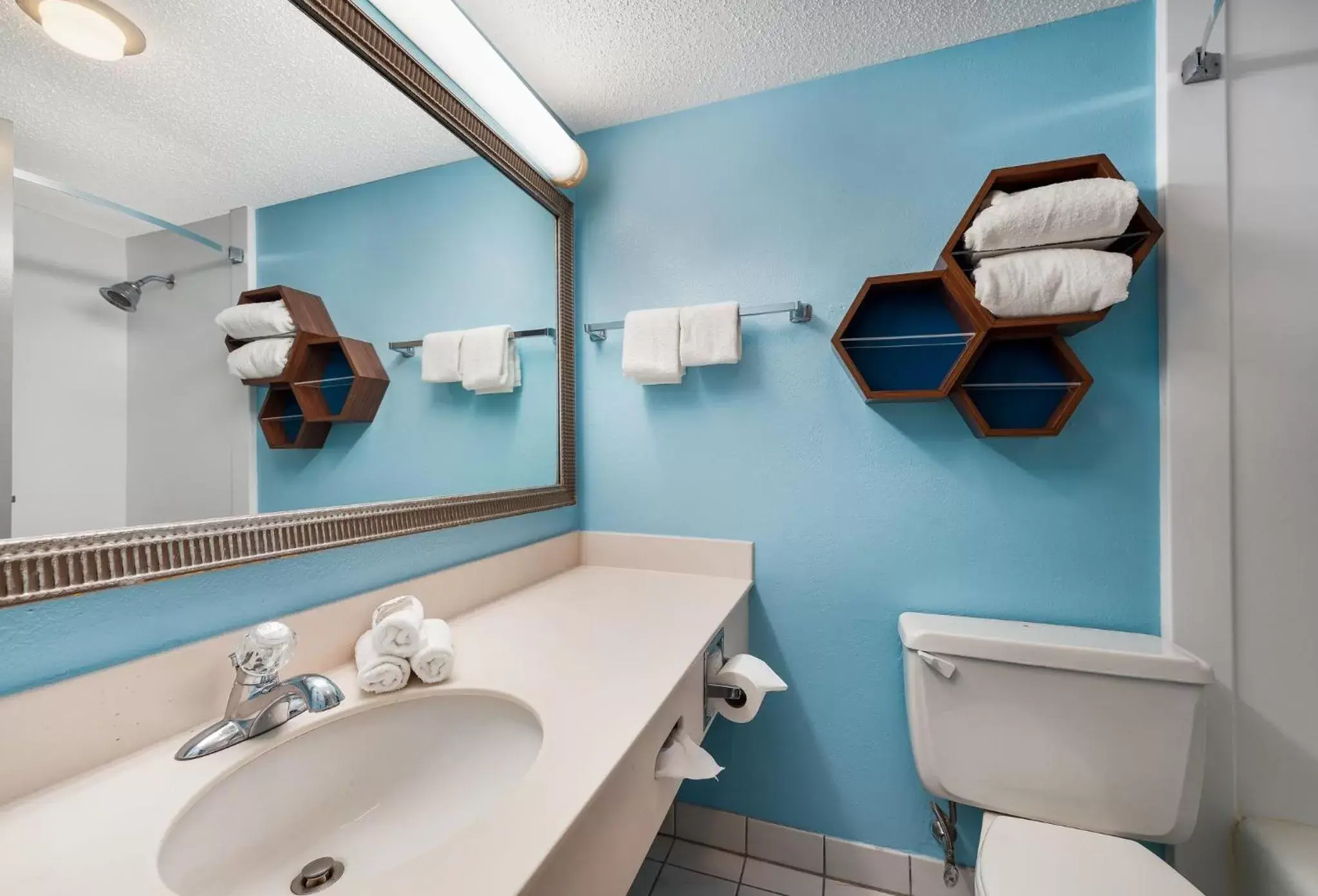 Bathroom in HomeTowne Studios by Red Roof Painted Post Bathroom in HomeTowne Studios by Red Roof Painted Post