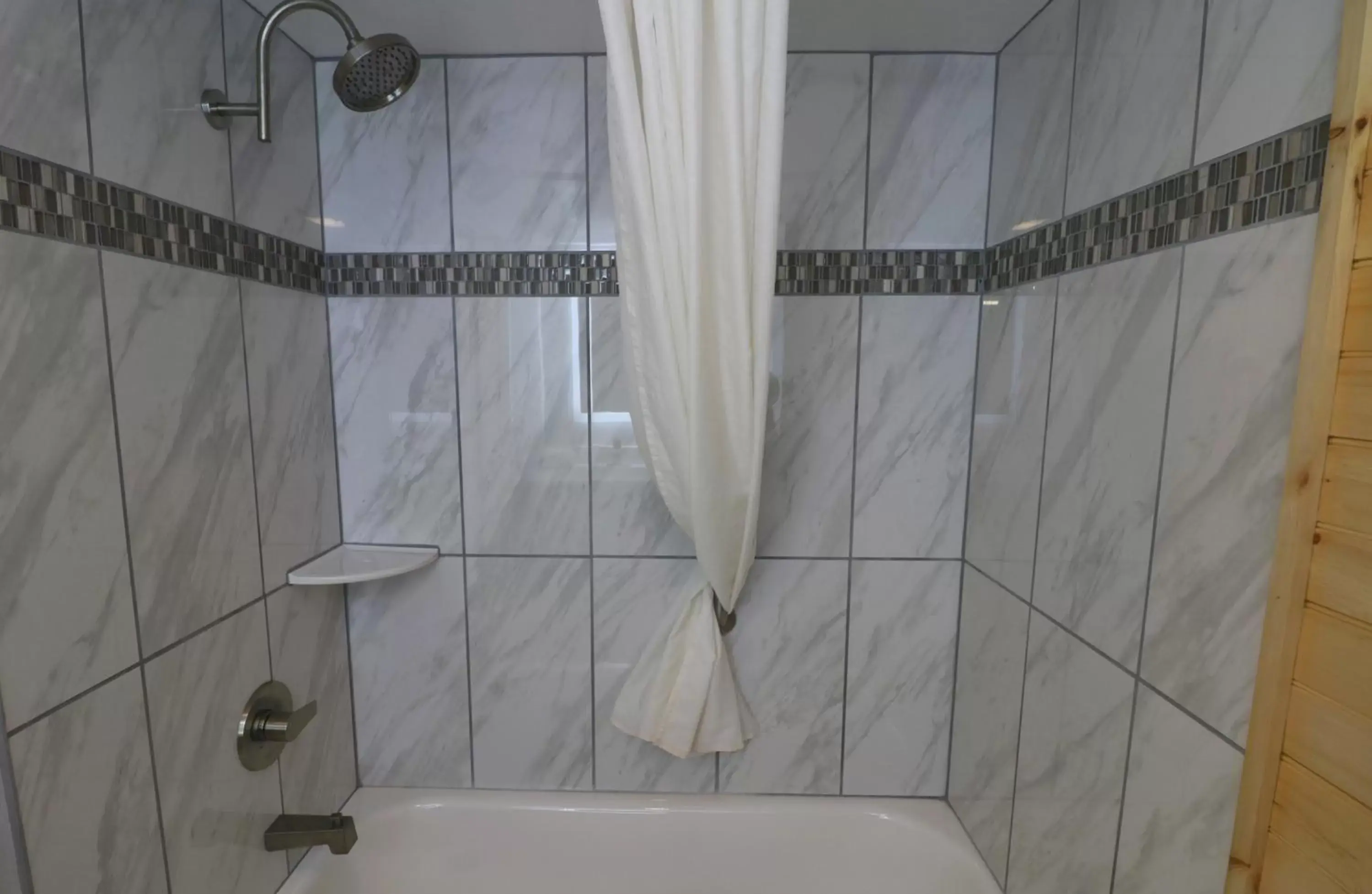 Bathroom in Howard Johnson by Wyndham Downtown Gatlinburg Bathroom in Howard Johnson by Wyndham Downtown Gatlinburg