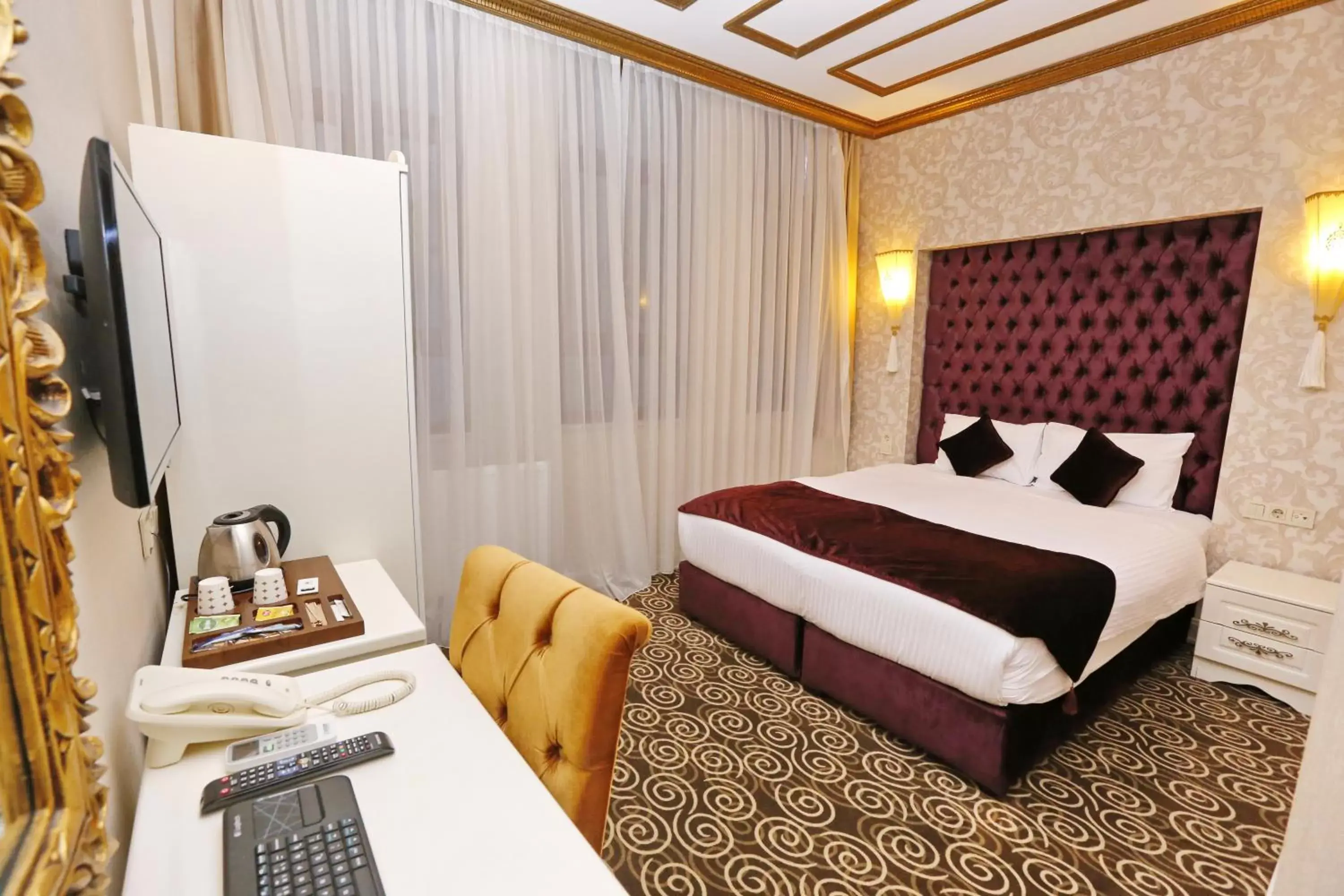 Bed in Diamond Royal Hotel