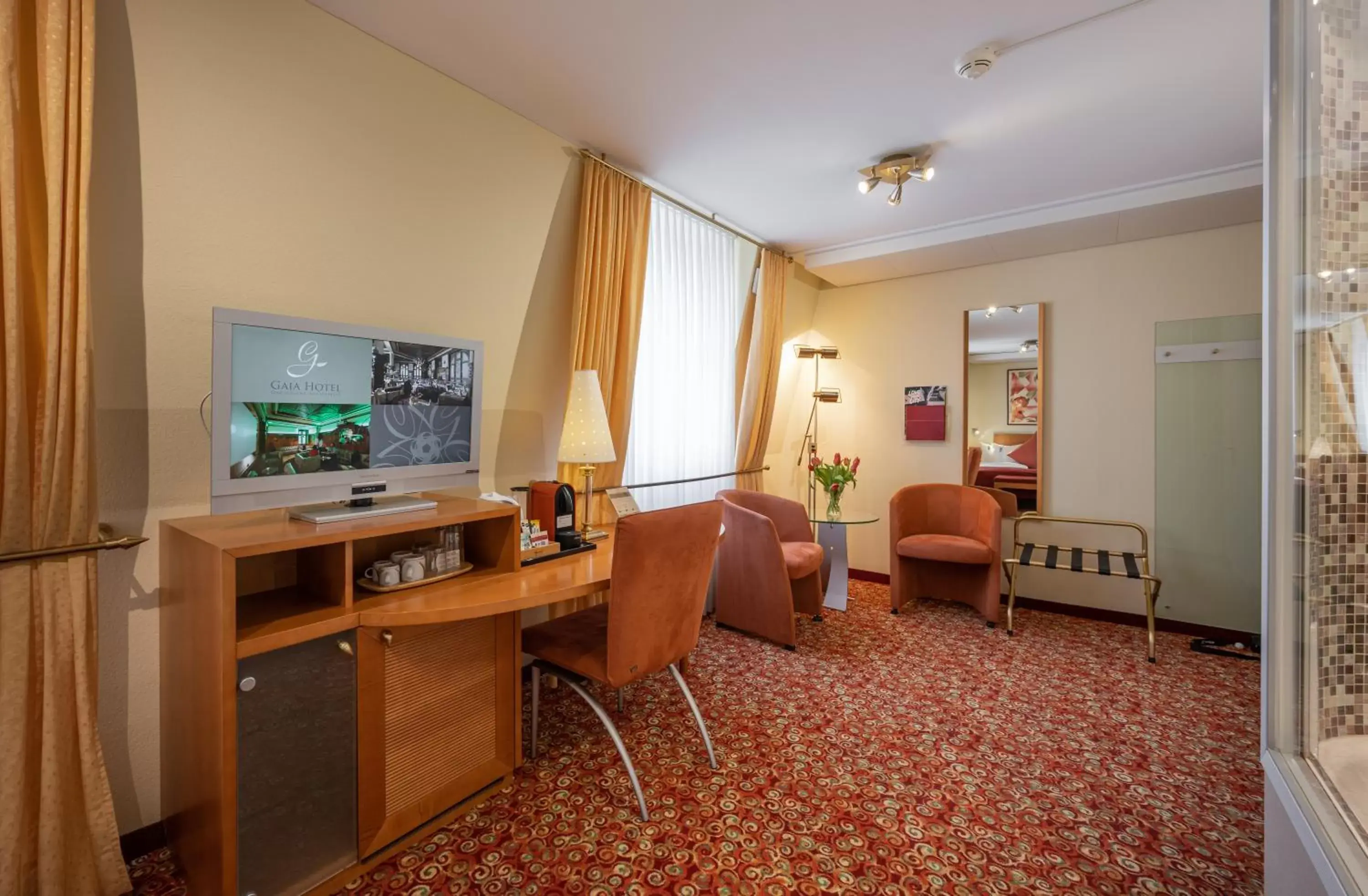 Living room, TV/Entertainment Center in GAIA Hotel Basel - the sustainable 4 star hotel