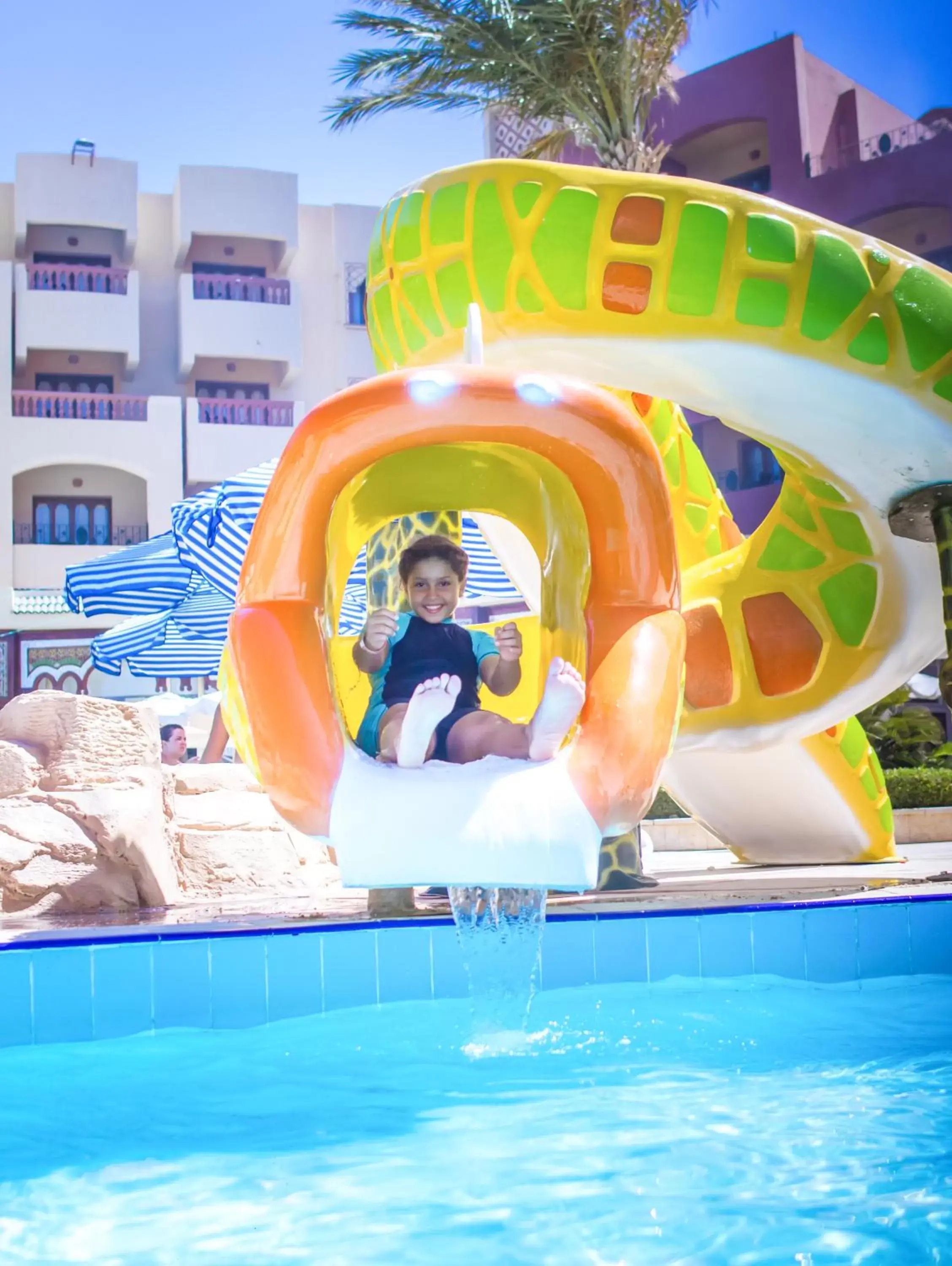 Swimming Pool in Sunny Days Mirette Family Resort