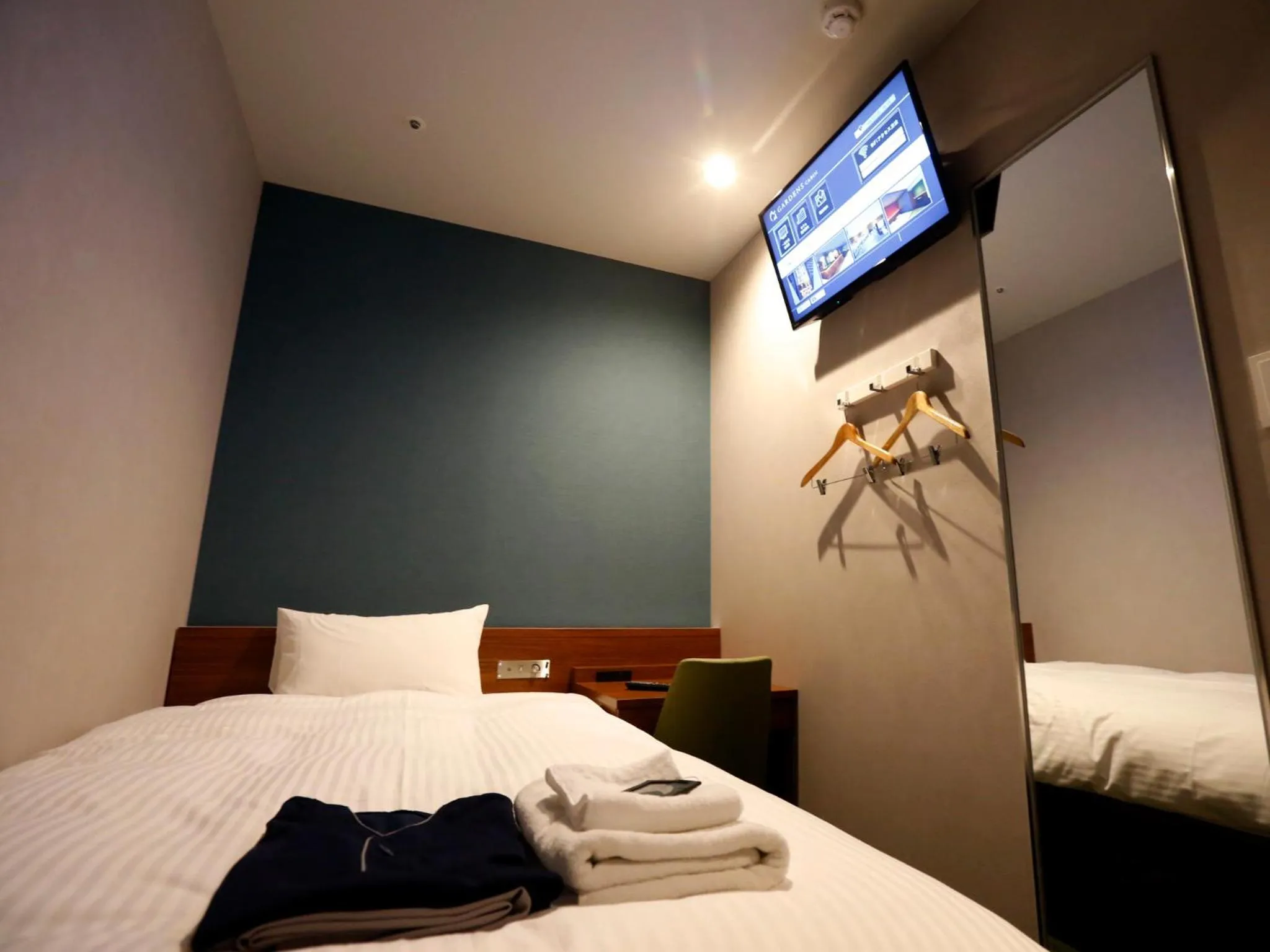 Bed in Gardens Cabin