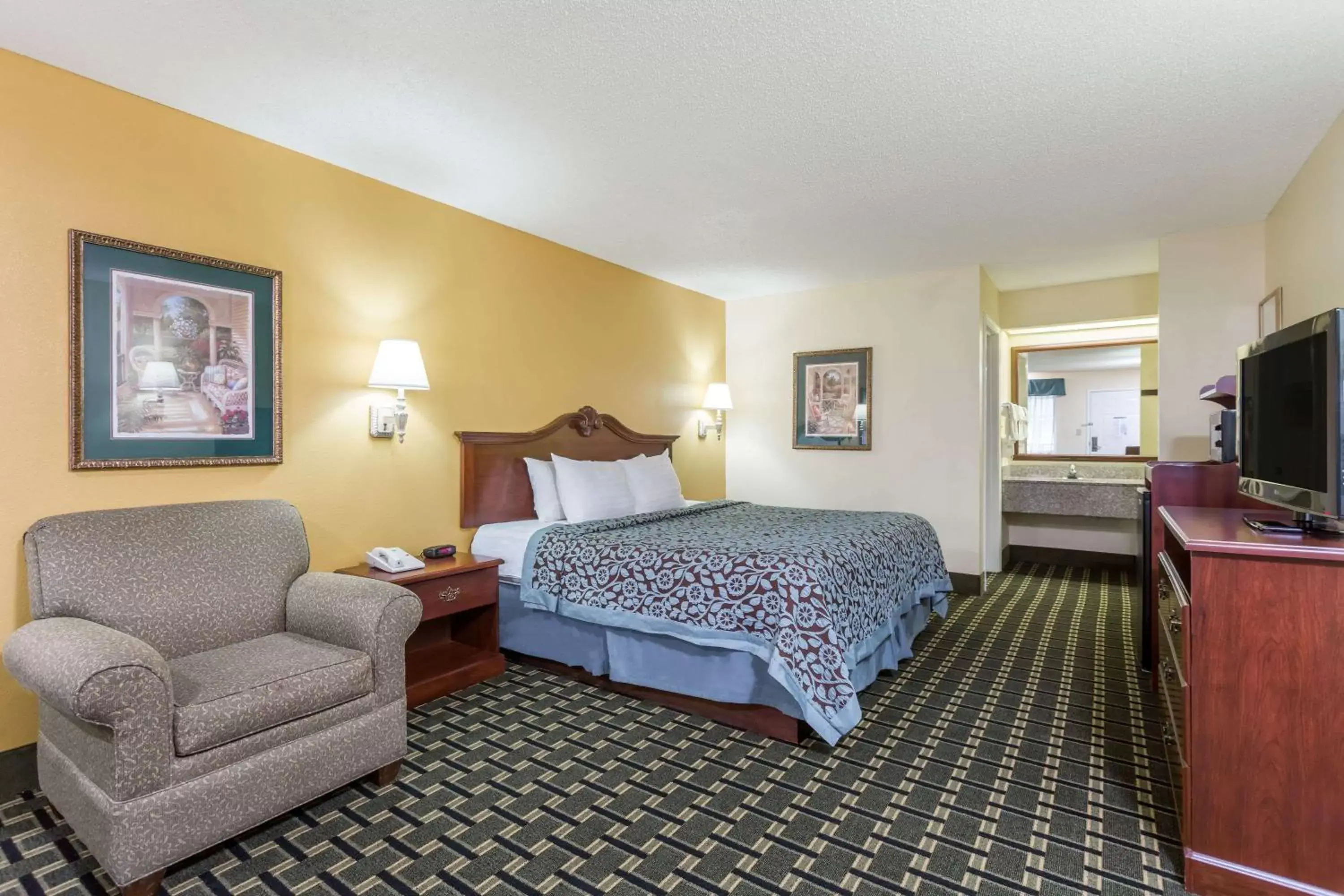Photo of the whole room in Days Inn & Suites by Wyndham Warner Robins Near Robins AFB