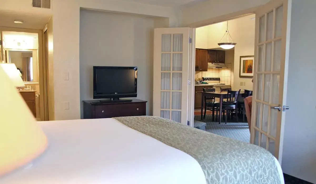 Bed, TV/Entertainment Center in New Haven Village Suites