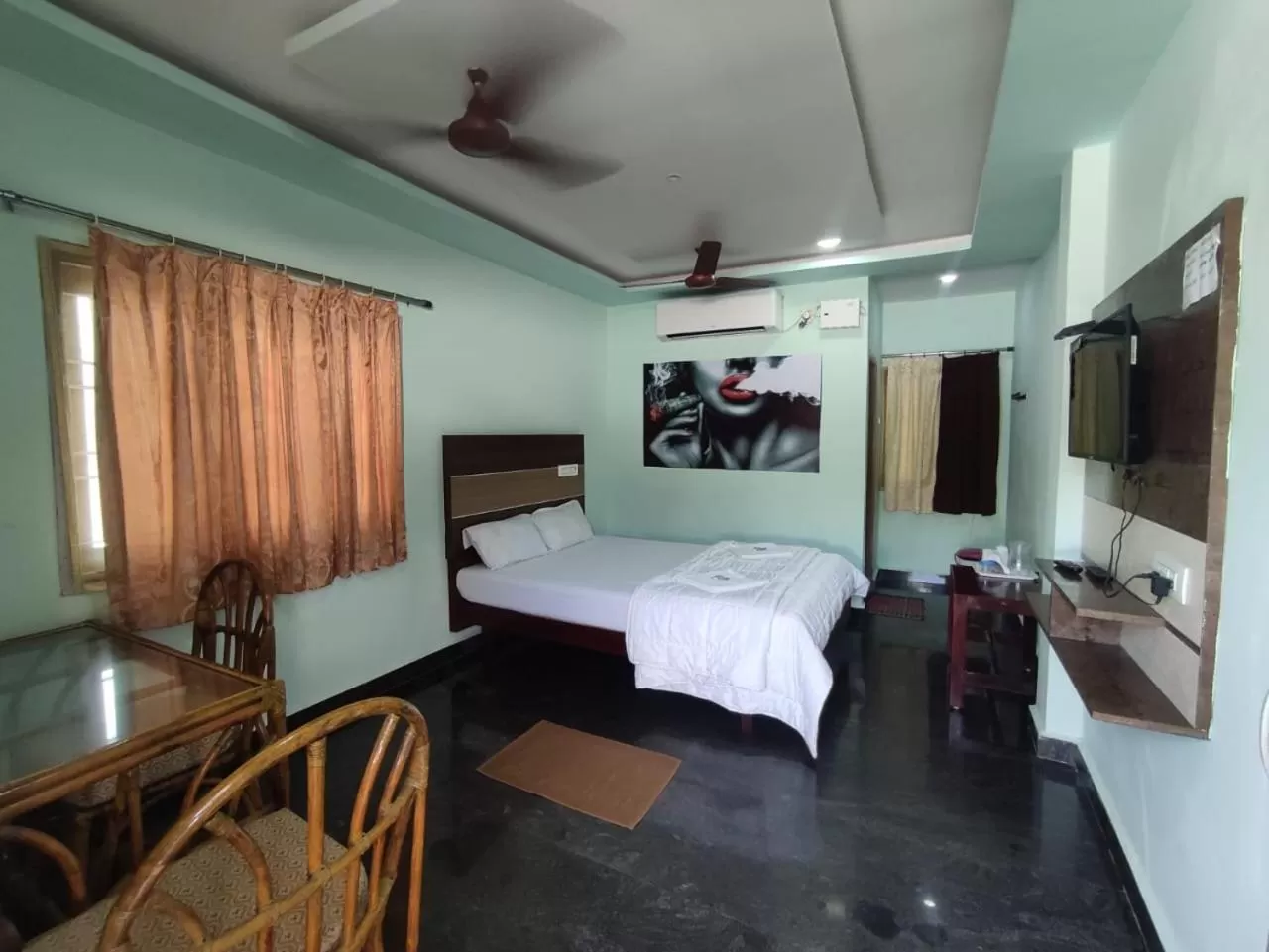 Photo of the whole room, Bed in Sri Murugan Beach Paradise Hotel