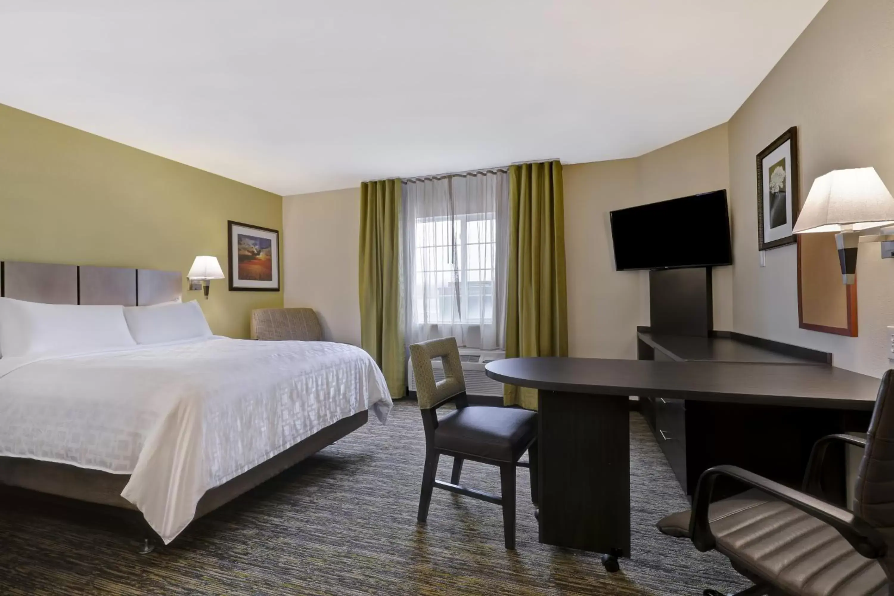 Bedroom, TV/Entertainment Center in Candlewood Suites Indianapolis - South, an IHG Hotel