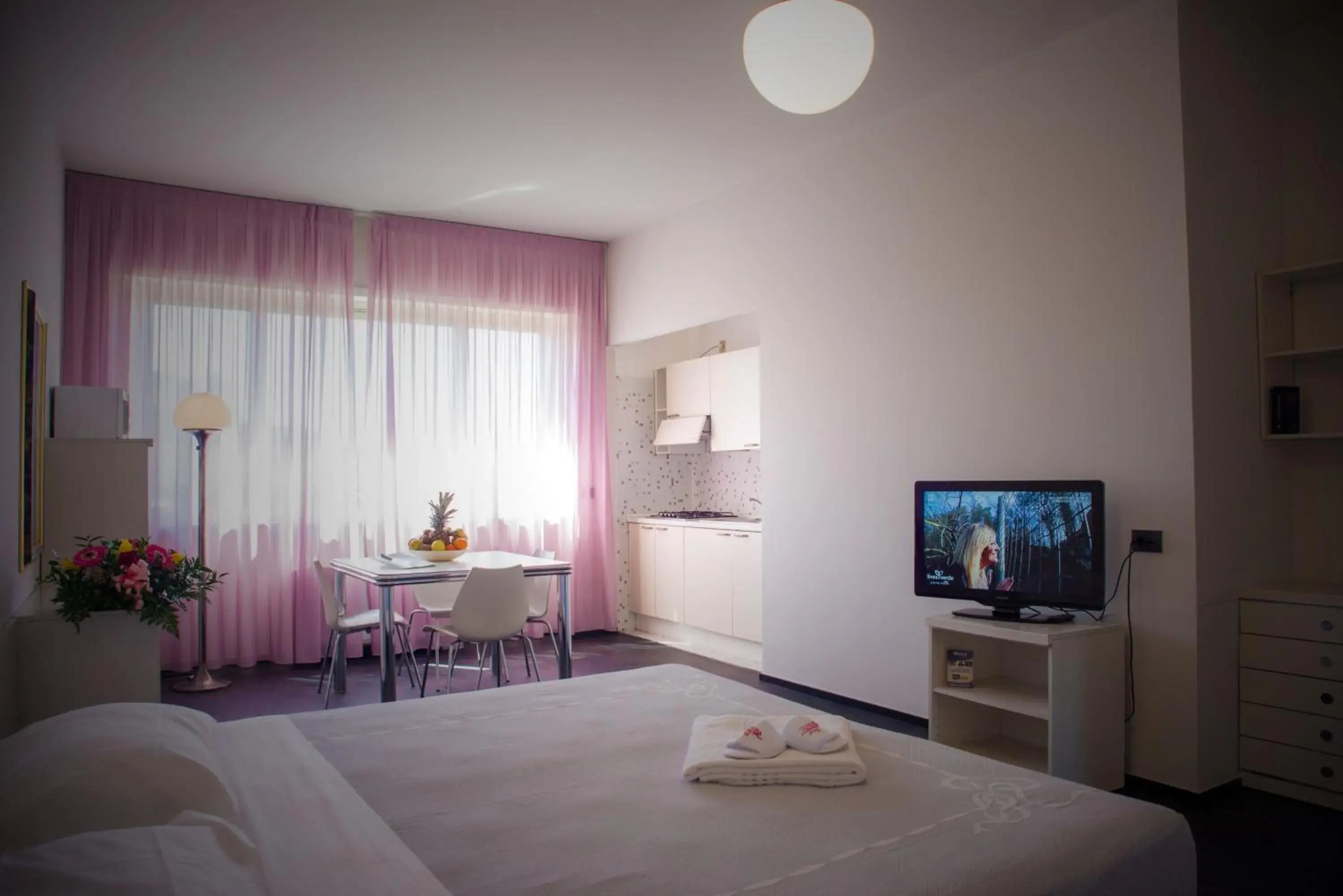 Photo of the whole room, TV/Entertainment Center in Residence Hotel Torino Uno