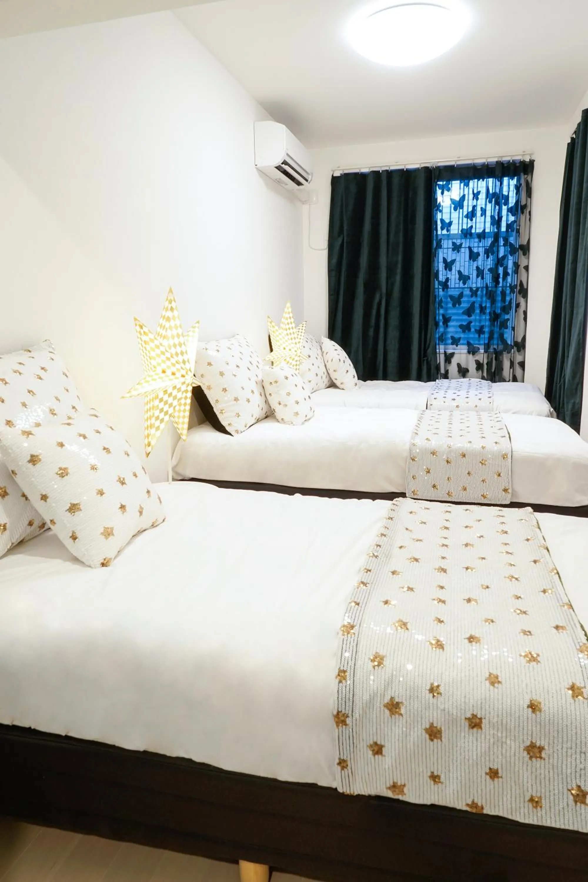 Bed in Blue Empire Hotel