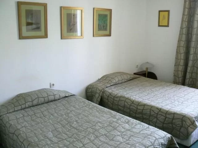 Bed in Family Art Hotel Gallery