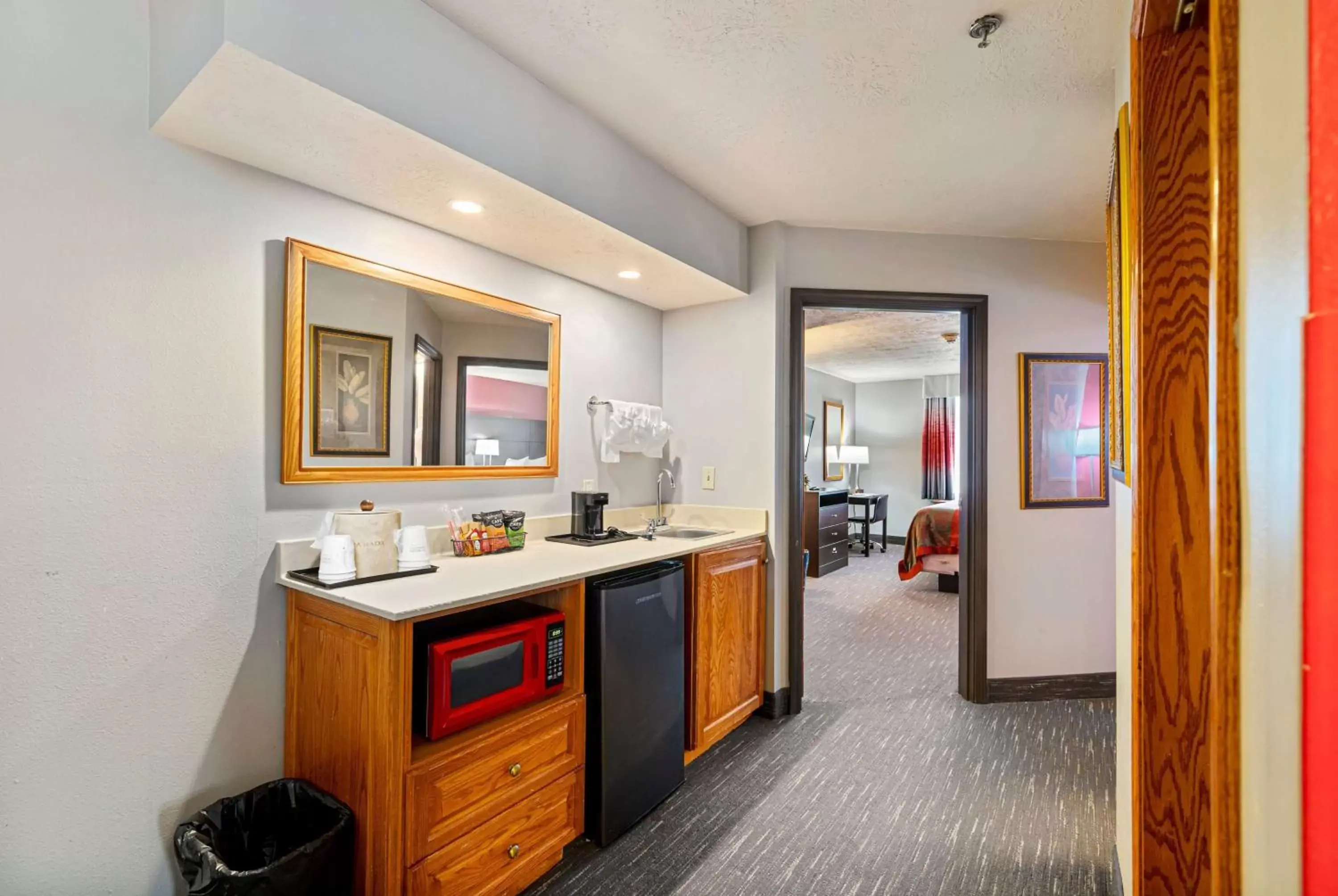 Photo of the whole room, Kitchen/Kitchenette in Ramada by Wyndham Sioux Falls Airport - Waterpark Resort & Event Center