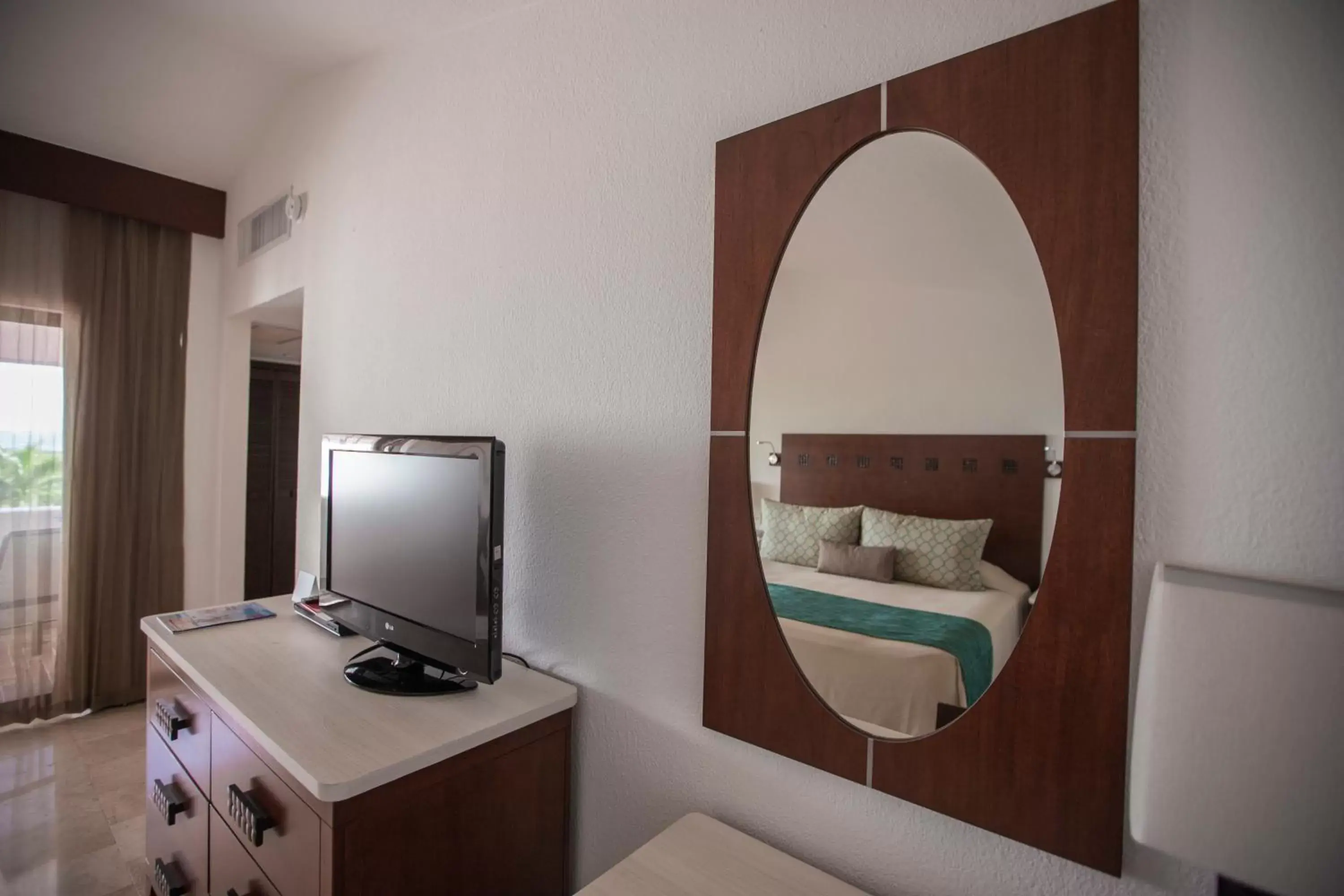 Bed, TV/Entertainment Center in The Villas at The Royal Cancun - All Suites Resort