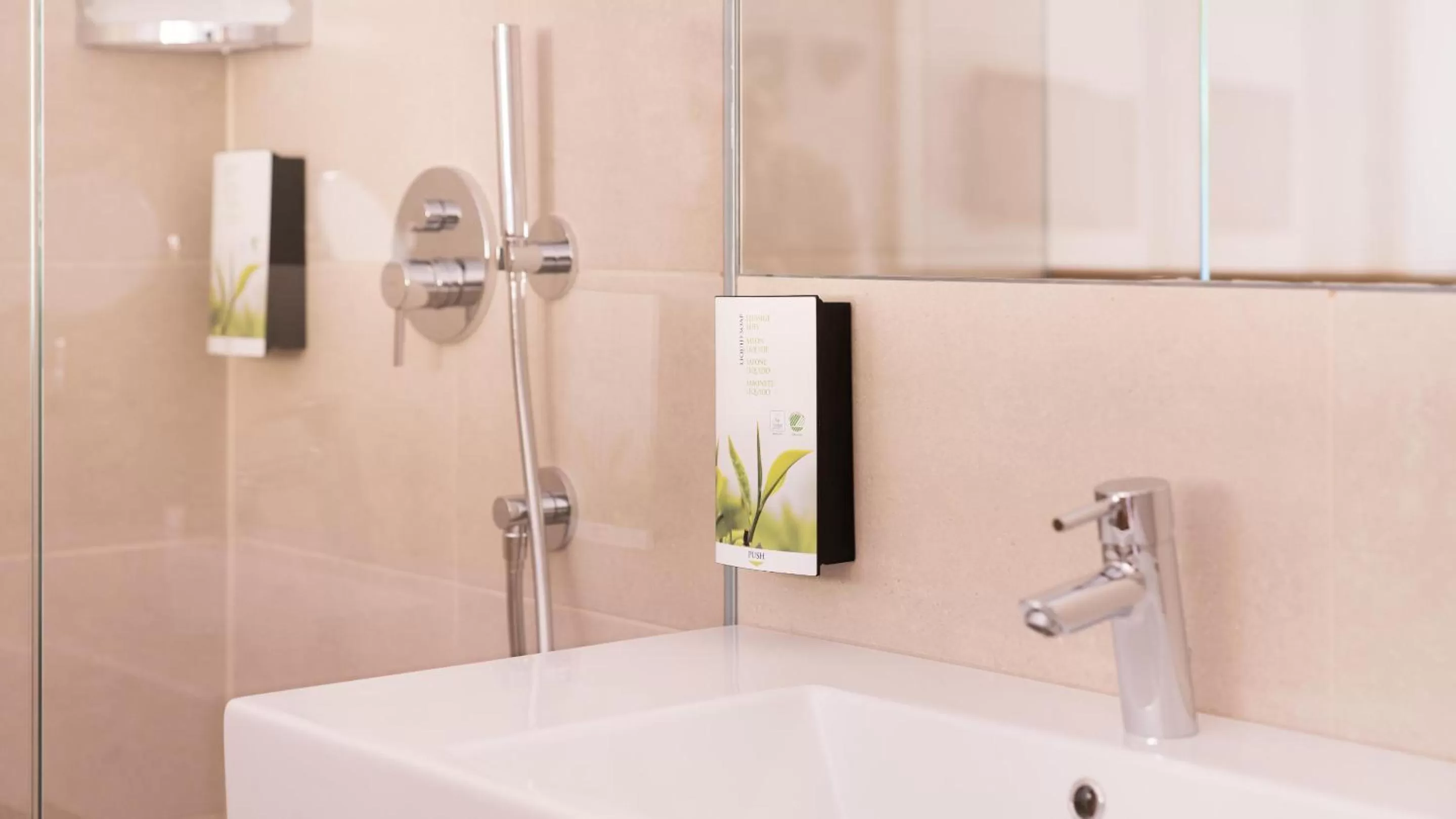 Bathroom in Flora Hotel & Suites