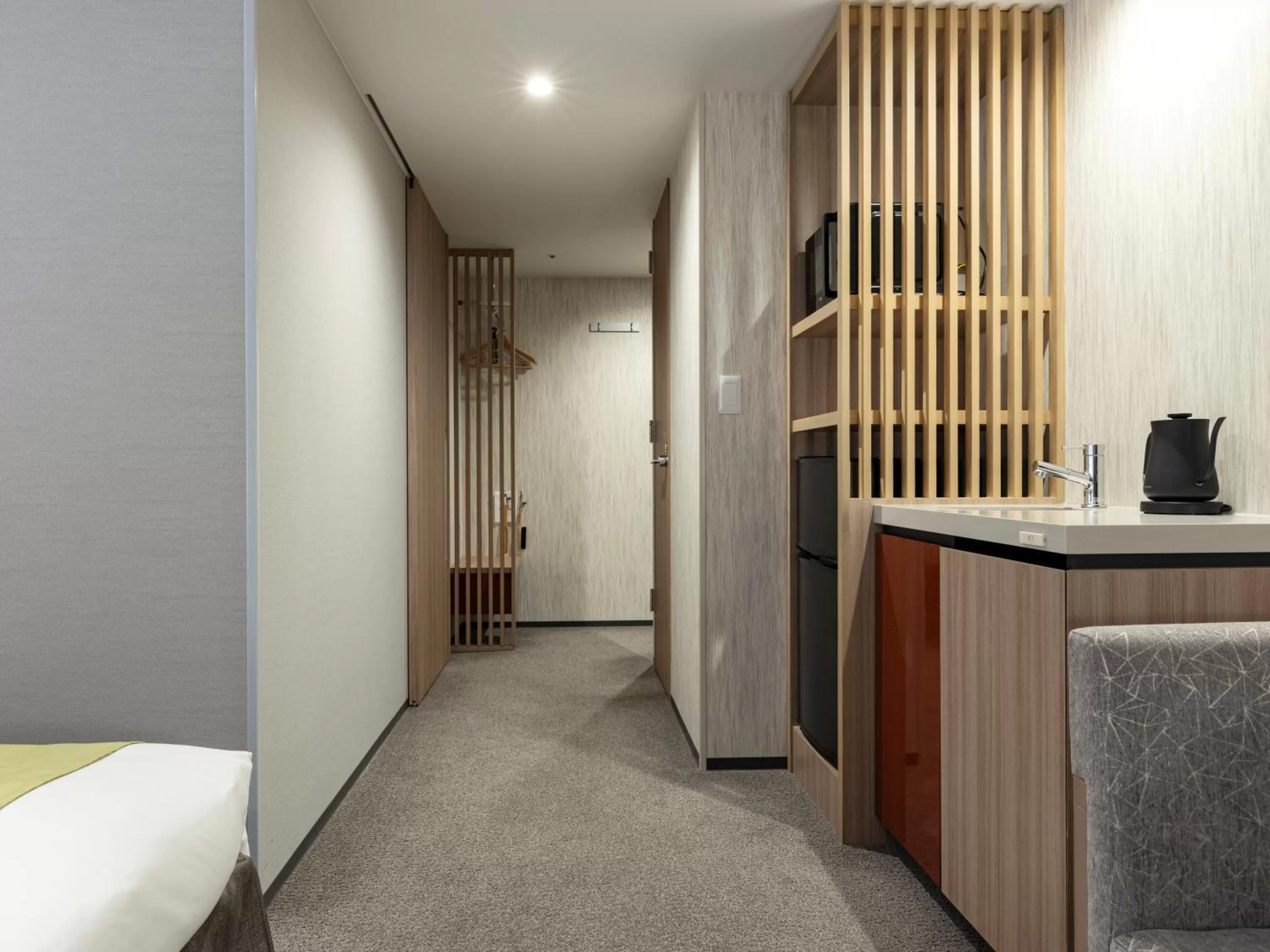 Kitchen or kitchenette, Bed in Tokyu Stay Kanazawa