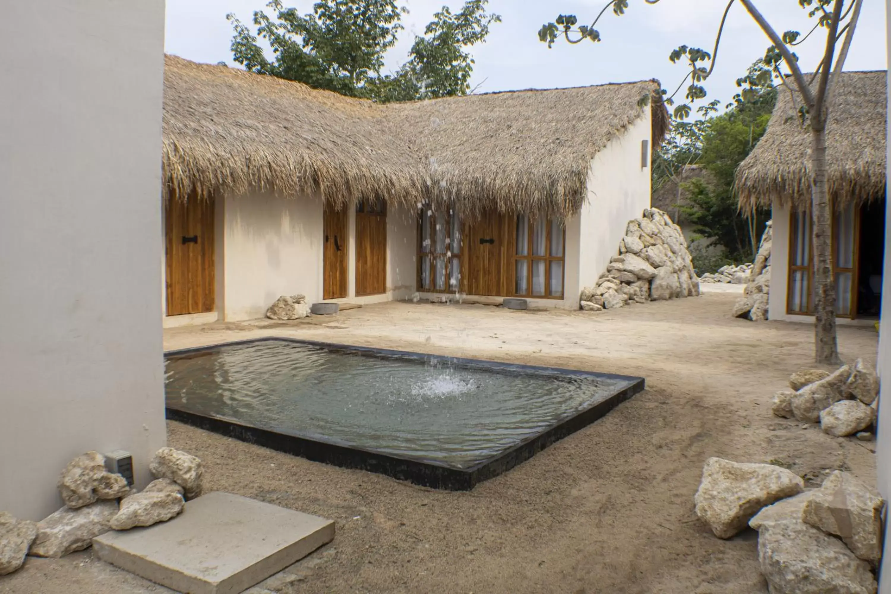 Property building, Swimming Pool in BH HOTEL & CENOTE TULUM - Adults Only